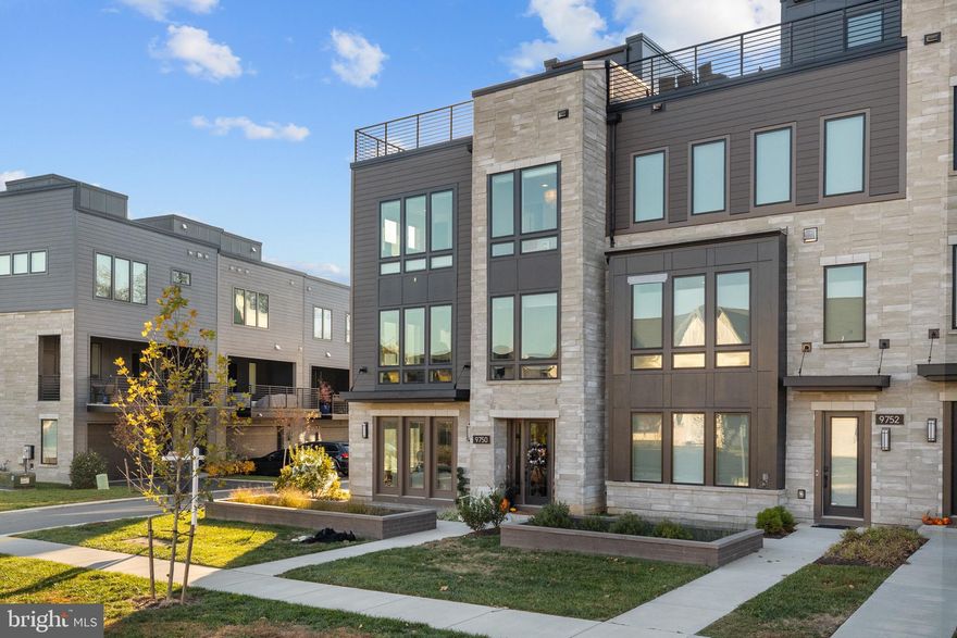 Unparalleled Luxury — Exquisite End-Unit Townhome with Private Elevator - Your Dream Home Awaits in the Prestigious Amalyn Community!
Experience the pinnacle of modern elegance and sophistication in this impeccably designed Madera end-unit townhome, offering nearly 3,300 square feet of refined living space. Since its construction, this residence has been enhanced with extensive premium custom upgrades, providing a lifestyle defined by comfort, convenience, and timeless luxury.  Featuring 4 spacious bedrooms, including one on the ground floor, 3.5 bathrooms, on 4 light filled levels.

Key Features & Upgrades:
Private Elevator — Enjoy effortless access to every level, offering ultimate convenience and accessibility.
Stunning End-Unit Design — Flooded with natural light from expansive window walls, creating an airy and inviting atmosphere with exceptional privacy.
State-of-the-Art Smart Home Technology — Features an advanced security system, video surveillance, custom shades, built in speaker system and high-speed internet for modern living.
Roof Top Deck to relax and unwind after a long day, with outdoor speakers.
Covered outdoor living space off of kitchen.
High end finished closets.
Whole Home Water Softening & water filtration systems.
High End Jenair appliances including blended Panel refrigerator.
Statement island with bar seating and pendant lighting.

Resort-Style Community Amenities:
Take full advantage of Amalyn’s exclusive, resort-inspired amenities. The community clubhouse, located just steps away, offers an outdoor pool and splash pad, fitness center, outdoor kitchenette, locker rooms, and a media and gathering area. Stroll through the Zen garden, pocket parks, tot lot, and picturesque walking trails that wind throughout this thoughtfully designed neighborhood.

Prime Location:
Conveniently situated near top-rated schools, shopping, dining, and entertainment, this home offers easy access to major transportation routes—making commuting to Bethesda, downtown Washington, D.C., area airports, and METRO stations effortless.
Located just minutes from Balducci’s Grocery, Montgomery Mall, NIH, Walter Reed, and the vibrant retail and dining destinations of downtown Bethesda and D.C.
Zoned for Ashburton Elementary, North Bethesda Middle, and Walter Johnson High School.

Welcome Home!