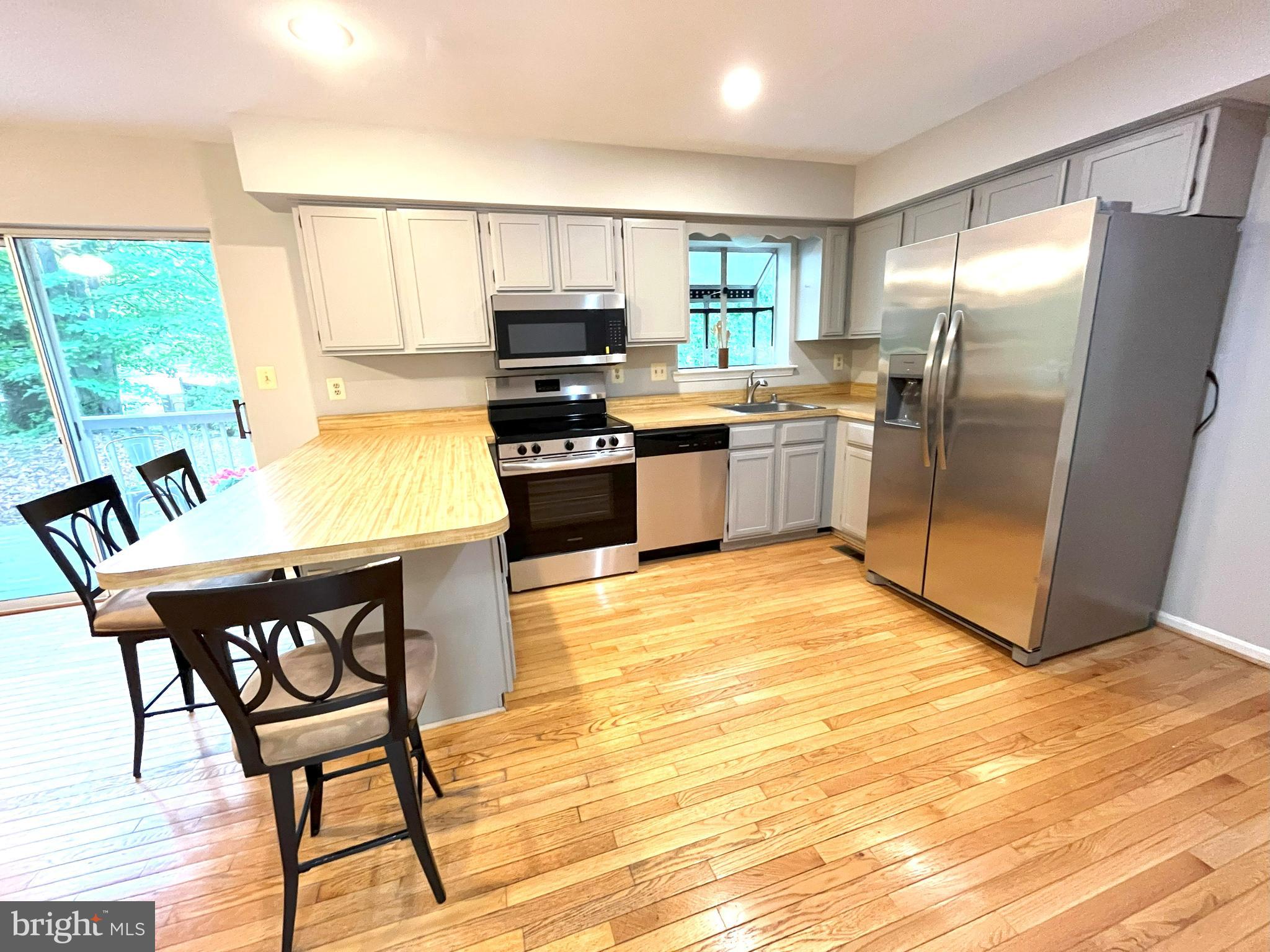 * Updated 6/19/25 Installed brand new Stainless Steel Appliances, Carpeting, Laminate Flooring. Gorgeous 3 level Colonial home on a large Cul-De-Sac featuring 4 bedrooms with the Owners Suite boasting a large walk in closet, 2.5 baths in the highly sought after Broadneck School District- Broadneck Elementary, Magothy River Middle and Broadneck High School. This home features a cozy Kitchen with brand-new Stainless-Steel Appliances (1 year manufacturers warranty) open to the Comfortable Family Room with a Brick Gas Fireplace, Beautiful Hardwood Floors, new laminate flooring and brand new carpeting. Enjoy a Rear Deck that overlooks a Serene Private Wooded Backyard perfect for your family’s barbeques. The 1 Car Garage is perfect for storing a vehicle especially since there is ample storage space in the home’s basement. Separate Dining Room and Formal Living Room with new laminate flooring makes this home great for Family Gatherings.