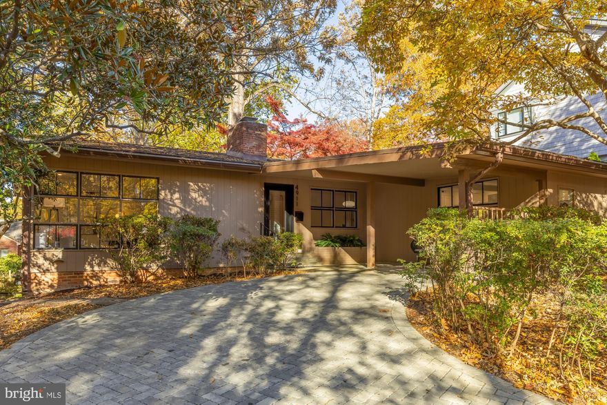 Rare light-filled mid-century modern gem in the heart of the coveted Town of Somerset in Chevy Chase, MD. This unique home features 4 bedrooms and 2.5 bathrooms and is nestled among mature trees steps from Little Falls Trail and a few short blocks from the Somerset Community Pool.

Step into a light-filled living area with hardwood floors, recessed lighting, and striking corner windows. A two-sided brick wood-burning fireplace connects the living and dining spaces, creating an airy and open environment ideal for entertaining. The spacious, sunken kitchen boasts new stainless-steel appliances, quartz countertops, island seating, and a large eat-in area perfect for dining and additional living space. The main level also hosts three bedrooms, including the sun-filled primary bedroom with its own en-suite bath. Two additional bedrooms share a bright hall bathroom.

The walk-out lower level features a generous above-grade recreation room with built-in bookshelves and direct access to the backyard through a large glass door. A fourth bedroom, finished laundry room, and a powder room are located just off the rec room. Two additional unfinished rooms provide abundant storage or the potential to easily create another bedroom or workout room.

Outdoor space abounds with a covered front flagstone patio, a long driveway with permeable pavers, a deep front yard, and a fenced-in backyard filled with mature plantings—ideal for gardening, play, or relaxation. A pull-down attic offers additional storage.

Extraordinary opportunity to live in the community of Somerset. The Town, with its very own town hall, offers a community swimming pool, tennis courts, and basketball hoop. In bounds for award-winning Somerset Elementary School. Amazing proximity to Little Falls Trail right behind the home, with easy access to Kenwood and Norwood Park. Conveniently located blocks from the retail and dining in Friendship Heights, along with the Friendship Heights Metro,  Whole Foods, Bloomingdales, the New Trader Joe’s, and more. Don’t miss this unique, move-in ready home!
