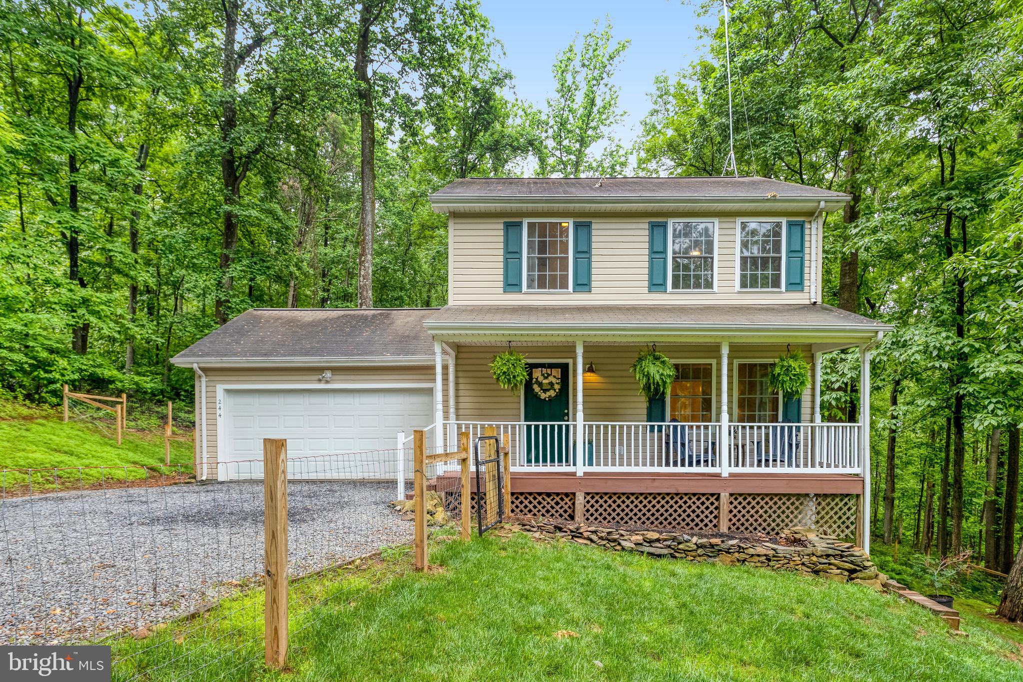 Spend summer at the lake! Welcome home to this well-maintained 4-bedroom mountain retreat on over 3 acres in Loch Linden! Experience the peace of living in the woods from one of three outdoor living areas, which include two Trex decks and a beautiful front porch that overlooks a fully fenced yard. Enjoy wintertime views of the Shenandoah River or spend summer at the private lake included in this community. The Loch Linden Property Owners Association offers a private, natural spring-fed lake and recreation area where you can enjoy fishing, canoeing, and kayaking. High-speed internet will be ready on day one with Starlink equipment conveying with the home! A rooftop antenna mast is already installed, providing the new owners with reliable high-speed internet service that supports working from home.
Updates include new appliances in 2024 (refrigerator, range, and dishwasher), HVAC units replaced in 2020 and 2024, fresh paint, and a new fence that was installed in 2024. On the first level, you’ll find a freshly painted living area, a kitchen with butcher block island and new appliances, a dining room, and an updated half bath. Upstairs, the primary suite features a private bathroom with large linen closet, along with two more bedrooms that share another full bathroom. On the lower level, there is a family room, a large fourth bedroom, a full bathroom, a laundry area, and four additional closets to meet all your storage needs.