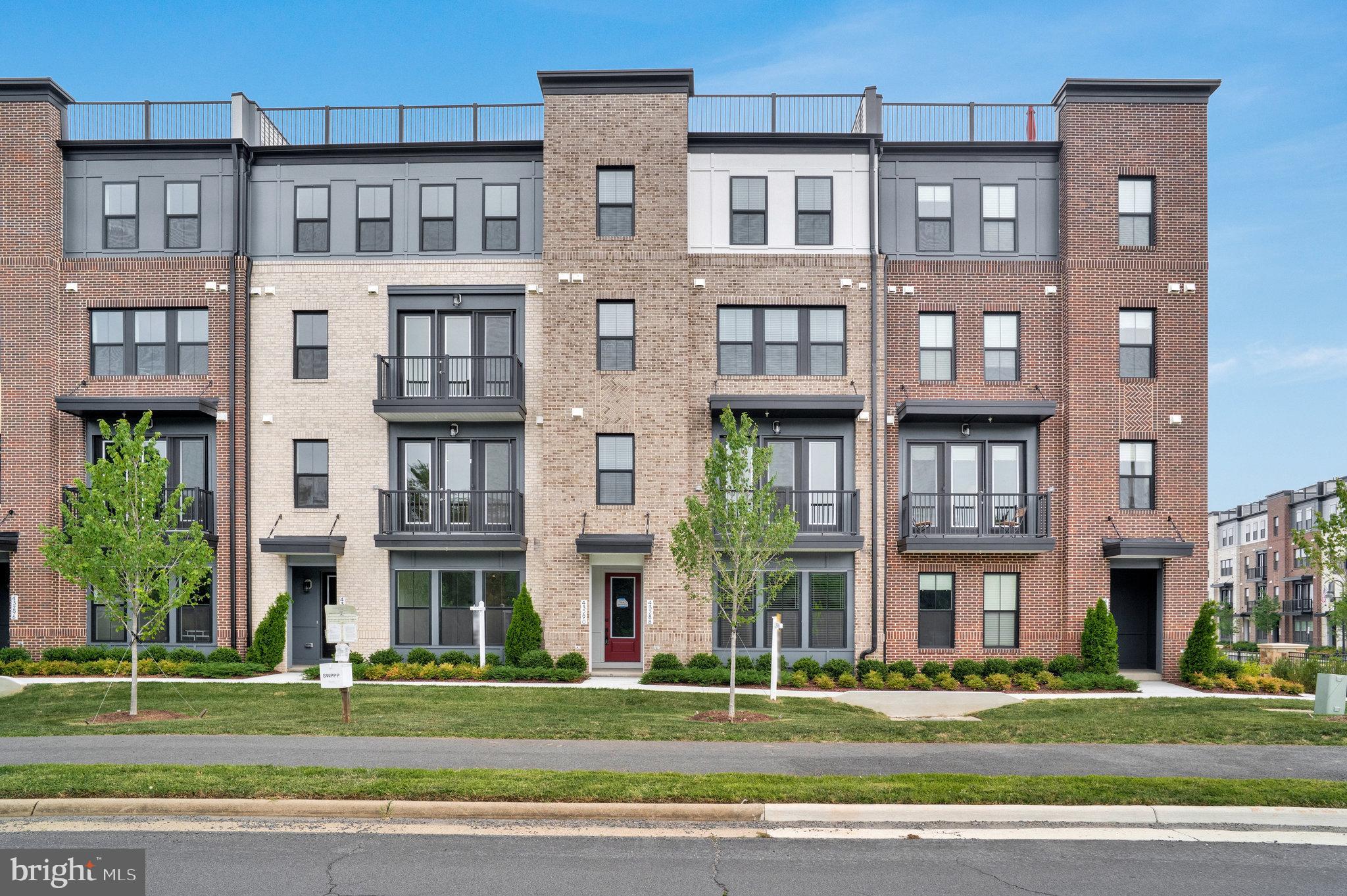 Be the First to Live in This Brand-New Townhome-Style Condo! Universal EV Charge| Includes Water & Sewer|
Ready for immediate move-in, this newly built 4-level townhome-style condo offers a perfect blend of comfort, style, and convenience—all wrapped in a sleek modern design.
Featuring 3 bedrooms, 2 full baths, 2 half baths, and a 1-car garage, this home lives large with thoughtful upgrades throughout. Step inside to a sun-filled entryway with a powder room and interior access to the garage. The open-concept main level showcases wide-plank flooring, 9-foot ceilings, energy-efficient LED lighting throughout, and a gourmet kitchen with quartz countertops, stainless steel appliances, walk-in pantry, and upgraded cabinetry. The adjoining family room flows out to a private balcony with peaceful views—perfect for your morning coffee or winding down after work.
Upstairs, the primary suite offers dual walk-in closets and a luxurious bath with double vanities and an oversized shower. A full-size laundry area is conveniently located on the same level for added ease. The top floor includes two spacious bedrooms and a shared full bath, ideal for guests, a home office, or flex space.
One of the standout features? An expansive rooftop terrace ideal for entertaining, relaxing under the stars, or simply enjoying the open air.
Located in the sought-after Broadlands community, just minutes to shopping, dining, Silver Line Metro, Dulles Airport, and major commuter routes.