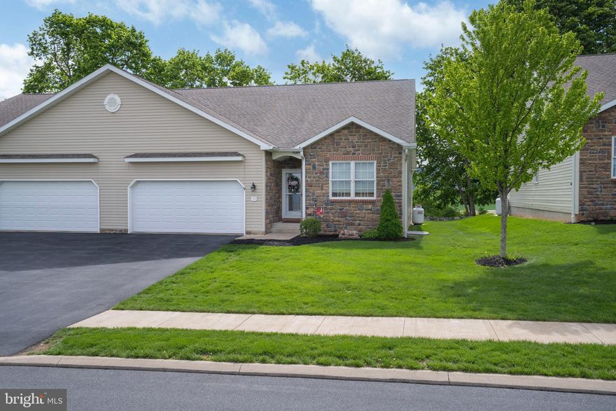 Experience the Best of Rosewood Cove Living in This Beautifully Custom Finished Condo. Enjoy the ease of seamless single level living with a finished lower level, tucked away in the tranquil Rosewood Cove community on the outskirts of historic downtown Bellefonte. Located just off Blanchard Street & less than 2 miles from I 99, this prime location offers a quick commute to State College & Penn State University while still providing a peaceful, tree lined setting.  Immaculate, one owner & truly move in ready, this unit features an open concept design crafted to impress. The grand great room showcases a soaring vaulted ceiling & cozy propane fireplace, creating a warm & inviting focal point. The dining room highlights gleaming Hickory hardwood flooring & sliding glass doors that open to the rear composite deck & patio perfect for taking in the endless farm views & neighboring mountain ranges.  The dining area flows effortlessly into the beautifully appointed kitchen, where rich Hickory hardwood flooring continues to add warmth & elegance. You’ll love the abundance of crisp white cabinetry, paired with a stylish ceramic tile backsplash & generous countertop space ideal for everything from weeknight dinners to weekend entertaining. A spacious breakfast bar with elegant pendant lighting offers the perfect spot for morning coffee, casual meals or gathering with guests. The kitchen comes fully equipped with included appliances & also features a handy pantry for extra storage.  Just beyond the kitchen offers direct access to the attached 2 car garage, making daily routines feel effortless.  The relaxing primary suite features a large walk in closet & an attached private full bath with ceramic tile flooring, a walk in shower & soaking tub. An additional bedroom with its own walk-in closet, another full bathroom & a dedicated laundry room with included washer & dryer completes the main living area.  The finished walk out lower level expands your living options with a spacious family room ideal for game day gatherings, a home office, another bedroom & a full bath providing flexible space for guests or multi purpose living.  Unfinished space offers ample storage.  A low monthly condo fee covers exterior building maintenance, exterior insurance, lawn care, snow removal & trash, making this home an ideal choice for those with a busy lifestyle or anyone seeking low maintenance living in a serene setting.  Thoughtfully designed, beautifully appointed & intended for effortless living, this Rosewood Cove gem delivers comfort, convenience & a peaceful sense of home from the moment you arrive.