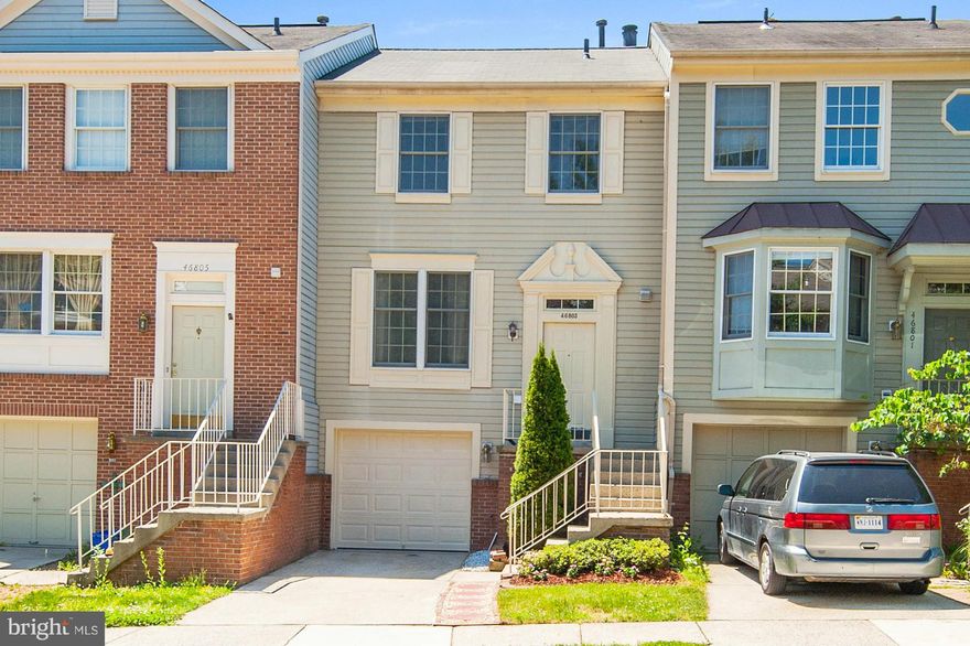 Spacious and Move-in ready Woodstone townhome! 3 bedrooms and 2.5 bath with a Garage! Open floorplan with huge living room and dining room. Eat-in kitchen with recently updated stainless steel appliances. It boasts brand new hardwood on main level and fresh paint throughout with a cozy wood burning fireplace in the recreation room. Huge deck & fully fenced! Come see it!