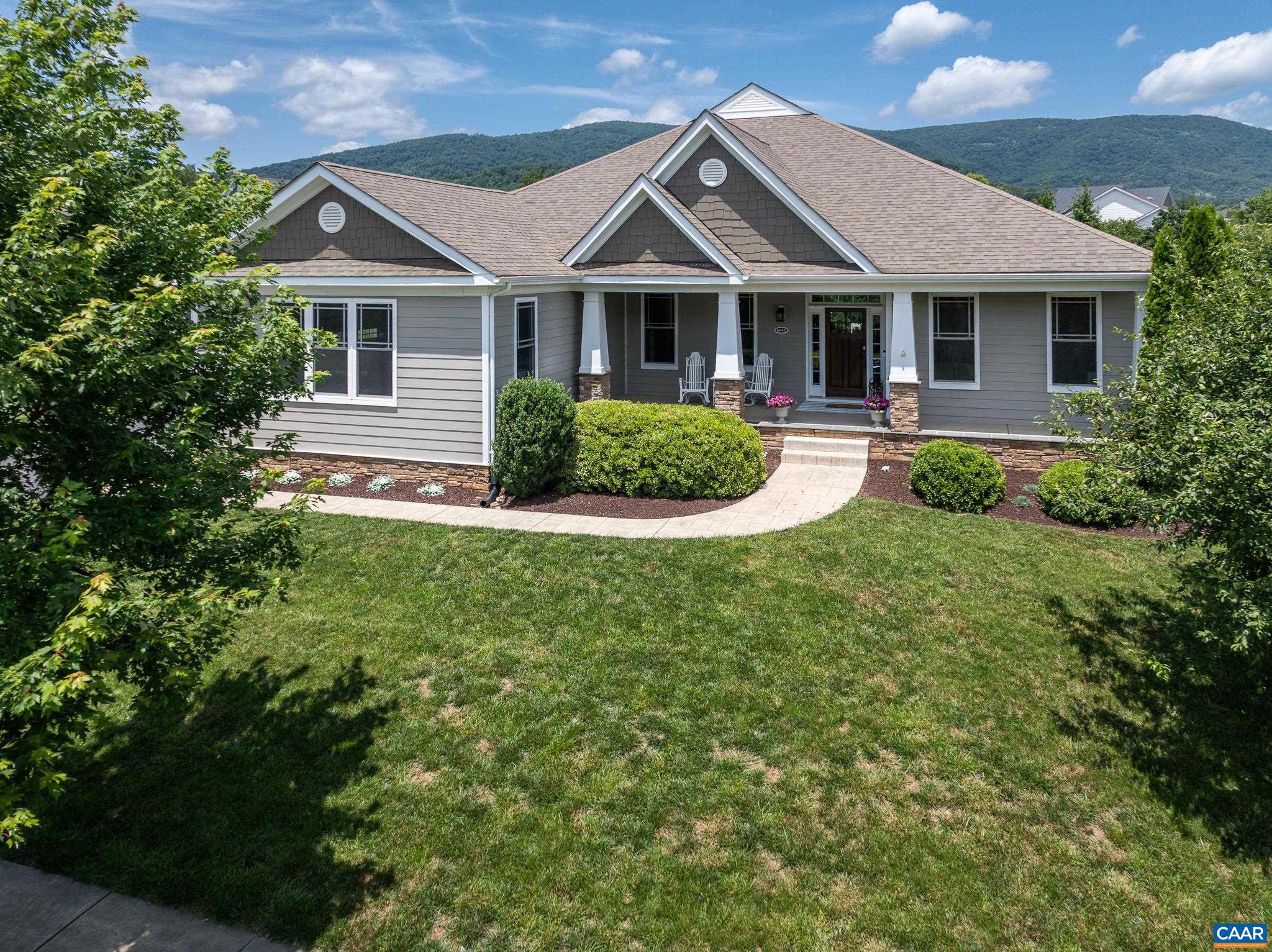 What you've been waiting for in Old Trail! One level living home on a flat, large lot with incredible mountain views, beautiful pool, and a finished walk out basement in Creekside! This home is perfect for entertaining inside and out. It features an open, modern floor plan with upgraded finishes throughout and shows like a new home!! Upgraded kitchen includes a 6 burner JennAir gas range, new refrigerator, walk in pantry, and plenty of counter and cabinet space to satisfy the cook in your home. Butlers pantry adjoins kitchen and dining for easy entertaining.The great room, breakfast nook and kitchen open to a fabulous screened porch and brand new deck with dual sided fireplace to keep you warm all year long. You'll love hosting dinners in the elegant dining room. Main floor also includes owners suite and 2 guest bedrooms along with an amazing mud room/laundry room. The basement includes craft room, large bedroom and full bath, a huge rec room, the most AMAZING wine room, and a workshop/unfinished space that is over 1000 sq feet. Walk outside and enjoy the mountain views, the ample seating area on the large paver patio surrounding the pool and the beautifully fenced and landscaped back yard.,Granite Counter,Wood Cabinets,Exterior Fireplace,Fireplace in Great Room