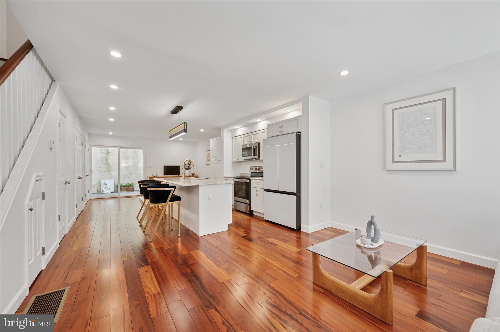 Welcome to this beautifully renovated 3-bedroom, 2.5-bathroom home in the heart of
Logan Square—one of Philadelphia’s most sought-after neighborhoods. Offering a
rare combination of modern luxury, prime location, and significant tax benefits, this
property is a true standout.
Recently renovated townhouse just two years ago, this stunning home showcases high-end finishes and thoughtful design throughout with excellent storage. Brazilian Tigerwood flooring flows
seamlessly across the living space, complemented by granite countertops and
premium appliances. Every detail has been carefully curated to create a cohesive
and elegant living environment. The first floor offers an open, flexible layout that merges style with
functionality—perfect for both everyday living or could be used as an amazing entertainment space. Expansive windows
and a sliding glass door flood the space with natural light, creating a warm and
inviting atmosphere. Centrally positioned, the sleek, modern kitchen anchors the
open-concept design, seamlessly connecting the dining and living areas. Step
outside to your private outdoor space, ideal for grilling, relaxing, and dining al fresco.
Thoughtfully placed closets and a discreet crawlspace provide valuable extra
storage.
The second level features two spacious bedrooms, each offering ample closet space
and abundant natural light. A full bathroom is conveniently located in the hallway,
while a well-equipped laundry area with built-in shelving makes folding and drying
simple and efficient.
The top floor is dedicated to a serene and luxurious primary suite, complete with
vaulted ceilings, skylights, and a spacious walk-in closet. The en-suite bathroom is
elegantly appointed, and the private patio offers a tranquil retreat with sweeping
views of Center City—your own urban sanctuary above it all.
Outside, enjoy unmatched walkability with a Walk Score in the 90s. Just moments
from the Schuylkill River Trail and offering easy access to I-76 and I-95, this location
also puts you minutes from cultural landmarks like the Philadelphia Museum of Art,
the Franklin Institute, and 30th Street Station. Daily errands are effortless with Giant,
Trader Joe’s, and Whole Foods nearby, while the vibrant shopping, dining, and
cultural scenes of Rittenhouse Square and Center City are just a short stroll away.
Families will also appreciate that the home is located within the catchment of the
highly coveted Greenfield Elementary School (K–8), a National Blue Ribbon School
recognized for academic excellence. The property also benefits from a 10-year tax
abatement, offering substantial long-term savings.
Don’t miss your chance to own this rare gem in Logan Square. Schedule your private
showing today and experience luxury city living at its finest.