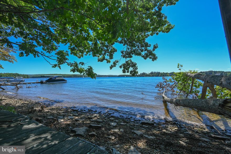 Lakefront lot with fantastic views in Thousand Acres. Gently sloped with an additional lot across the street too.!  Approved for a five (5) bedroom home.  Private location with Thousand Acres Golf Course only minutes away.  Perfect for your mountain lake escape.  Also checks all the boxes to be an incredible vacation rental property.