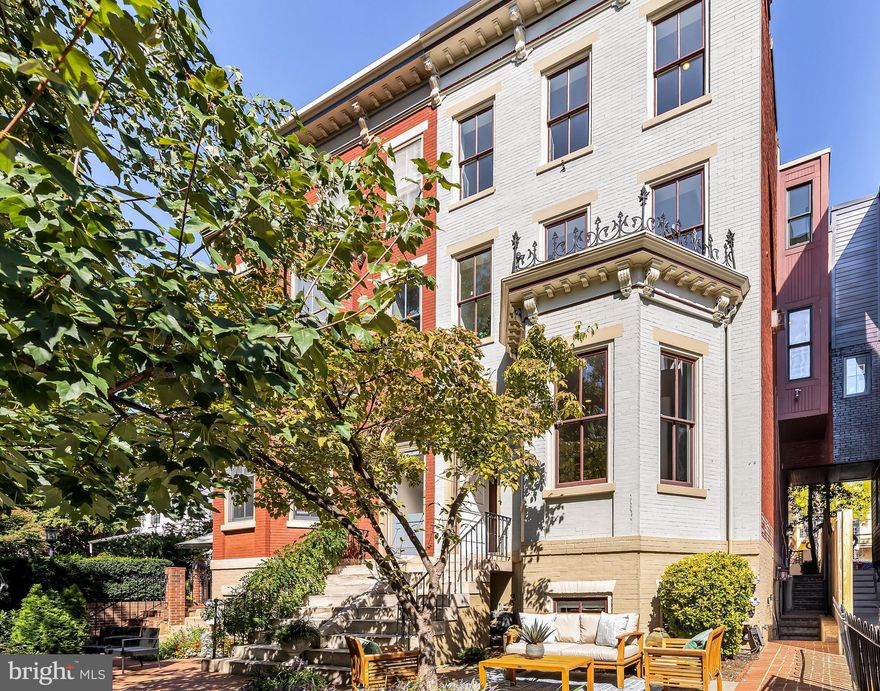 1429 Q St NW is a truly exceptional property that seamlessly blends historic charm with modern versatility in one of the most desirable streets in Logan Circle. This stunning Victorian residence offers the best of both worlds, combining original architectural elegance with contemporary functionality and multiple opportunities for sophisticated living.

Its front garden welcomes you in to discover a flexible main level that is perfect for various living styles. It features a gracious entry foyer and spacious living room with a bay window.  This space flows into a fully equipped living space complete with kitchen, an open living and dining area, a full bathroom, bedroom and laundry.  With convenient access to the side garden and parking, this space presents an unparalleled versatility for multi-generational use, as an Au Pair suite, a catering kitchen, or simply an extended space for entertaining guests. 

The residence’s second level continues to impress with a sizable main kitchen, a dining room, and a powder room.  A spacious family room with a gas fireplace, built-ins, and a south-facing wall of windows streaming in natural light, completes this level.   The third level is illuminated by a stunning skylight that floods the space with natural light. It is comprised of three bedrooms and two bathrooms, along with the convenience of a full-size, side-by-side washer and dryer.

For added flexibility and income potential, the residence includes a fully-finished Au Pair suite with a full kitchen, bedroom, bathroom, and an in-unit washer and dryer.  Two-car parking exists behind the residence, offering yet another invaluable feature for this area.  

Situated in the historic Logan Circle neighborhood, you're just steps away from renowned dining the likes of Le Diplomate and the Barcelona Wine Bar.  Enjoy the convenience of shopping, the Metro, and easy access to downtown and more. With a lifestyle that can't be beat, 1429 Q St NW is the perfect place to call home. Welcome home to luxury, history, and endless possibilities!
