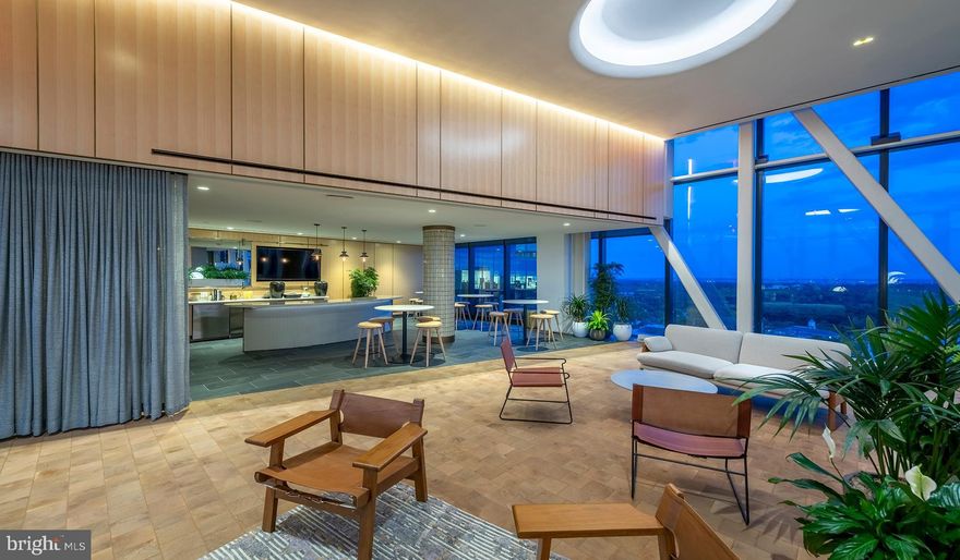 Experience the Pinnacle of Urban Living at The Elm, Bethesda

Nestled in the vibrant heart of Bethesda, adjacent to the bustling Bethesda Row, The Elm presents an exquisite blend of modern living and environmental consciousness, certified by its prestigious Gold LEED status. Our diverse range of homes, including studio, 1-, 2-, and 3-bedroom options, are meticulously designed with contemporary finishes, state-of-the-art stainless steel appliances, and an unparalleled location in the center of Bethesda.

Elevate Your Lifestyle with Exceptional Amenities. At The Elm, indulgence meets convenience. Soar to new heights of relaxation at our 28th-floor rooftop pool or embrace wellness at our modern fitness center. The 17th-floor landscaped terrace offers a serene escape, while our expansive Skybridge on the 28th floor provides a unique vantage point. Our community spaces, including lounge areas and workspaces, cater to your every need, mere steps from a plethora of dining and retail options.

Discover Unparalleled Living Spaces. Our homes and penthouses boast double-height ceilings, bathing each space in natural light. Revel in the luxury of walk-in closets and modern kitchens equipped with Bosch and Samsung appliances. Select homes further enhance your living experience with private balconies and patios.

Immerse Yourself in the Cultural Hub of Bethesda Row. Reside in the epicenter of culture, dining, arts, and entertainment. The Elm is a stone's throw away from Woodmont Triangle, a vibrant nexus of cultural activities and community events. Enjoy an array of outdoor concerts, art festivals, and farmer's markets that animate the neighborhood year-round.

Redefine Relaxation and Productivity. Our rooftop pool is not just a swimming facility; it's an oasis of tranquility with resort-style seating and stunning panoramic views. The Elm's numerous spaces are designed for your relaxation, health, and convenience, offering a myriad of ways to unwind and rejuvenate.

Your Personal Sanctuary and Community Awaits. Whether you're immersing yourself in a captivating novel or engaging in meaningful conversations, The Elm offers the perfect backdrop. Our curated fitness studio caters to health enthusiasts with a convenient and inspiring workout environment. The 28th-floor Skybridge is an ideal spot for hosting events or enjoying private gatherings, all while being surrounded by breathtaking views.

Schedule Your Personalized Tour Today. We are dedicated to providing an exceptional living experience. Contact us to schedule a tour tailored to your preferences. The Elm is proud to be a smoke-free and pet-friendly community. Welcome to a new standard of living, where every detail is crafted for your comfort and convenience.

** Pricing and availability subject to change on a daily basis ** Photos are of model units ** Parking may be available for an additional fee **