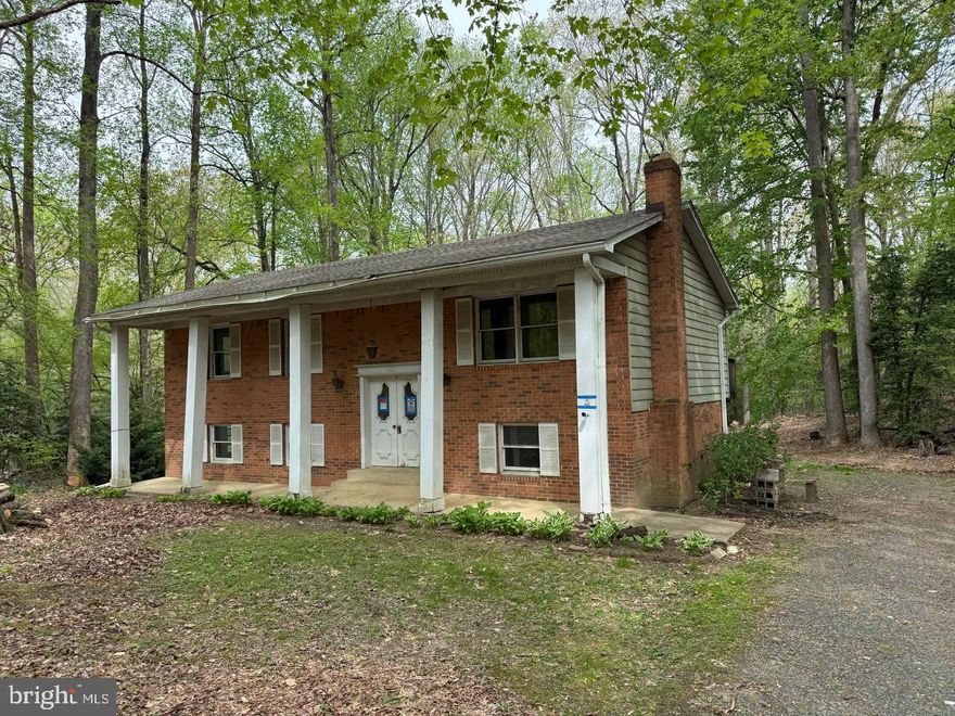 Deeply Discounted two level brick 4 bedroom 3 bath home on 3 acres in highly desirable Helen Estates.  Homes in this tight-knit community do not become available frequently so take advantage of this rare opportunity.  This property offers privacy and promise, a blank canvas ready for new Owner to bring their vision to life.   Home being sold AS-IS, Seller will make no repairs.  Passing well and septic inspections with documentation.