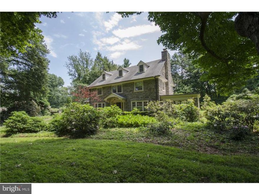 Impressive 6 foot wrought iron estate fencing and tall arched gate surround this beautifully constructed cut stone home on .89 acres on most desirable Glenview Road in Bryn Mawr.  Classic Center Hall design opens to a gracious elegant Foyer with sweeping stair and straight through views of the rear property and mature evergreen border.  The Dining Room is positioned to the left of the Foyer with swinging service door to Butler's pantry, Breakfast Room and beyond to the renovated Kitchen highlighted by furniture quality cabinets and Iberian marble counter tops.  To the Right of Foyer find the formal Living Room with refinished hardwood floors, wood burning fireplace with brick surround and light filled enclosed brick terrace with exquisitely mullioned glass and exit doors to the side and rear yards.   Two Powder Rooms and well as a front and back stair and enclosed Mudroom complete this first level.   Ascend the main stairs to find three Family Bedrooms, one originally purposed as a nursery, Jack and Jill Bath as well as a Master suite with private bath.  Gleaming hardwood floors and true divided lite windows impart warmth and charm to each room.   A large linen closet with original fittings offers ample storage and generous flat folding space.  Turned stair leads to the third level with heart pine floors, three additional bedrooms and full hall bath with soaking tub.   Unfinished Lower Level with bilco doors to side of property offers excellent primary storage and laundry space.   Two car-detached Garage has additional "chauffer's" Bedroom and Bath off an independent curved stair accessed through the two car garage.  Exceptionally positioned with generous front, side and rear yards on idyllic tree lined street.   Awaits the next owners' updates and creative input.