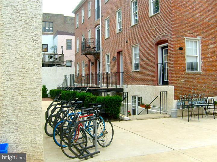Nestled in the heart of Northern Liberties, is an affordable 9 year old 1 bedroom trinity that looks like new construction. Low maintenance, beautiful and secure pet friendly, courtyard setting in walking distance to all of the fun social venues that the neighborhood has to offer. This cozy condo offers low condo dues, low utility bills and all of the creature comforts you desire. Hardwood floors throughout, carpet in the bedroom, and tile in the full bath. The living room is on the entry level and has a video intercom that allows you to see who is at the gate and buzz them in. The beautiful eat-in kitchen with Cherry Wood Cabinetry, Black Polished Granite and Stainless Appliances (gas cooking) are in the lower level. The 2nd floor has the full bath and laundry, and the 3rd floor is the bedroom level with skylight. This is a corner unit so it is flooded with natural light. The common grounds have seating, a grill and is reminiscent of a European courtyard paved in cobblestone. Great for someone looking for low maintenance living in a premier location. Welcome to Cobblestone Court.