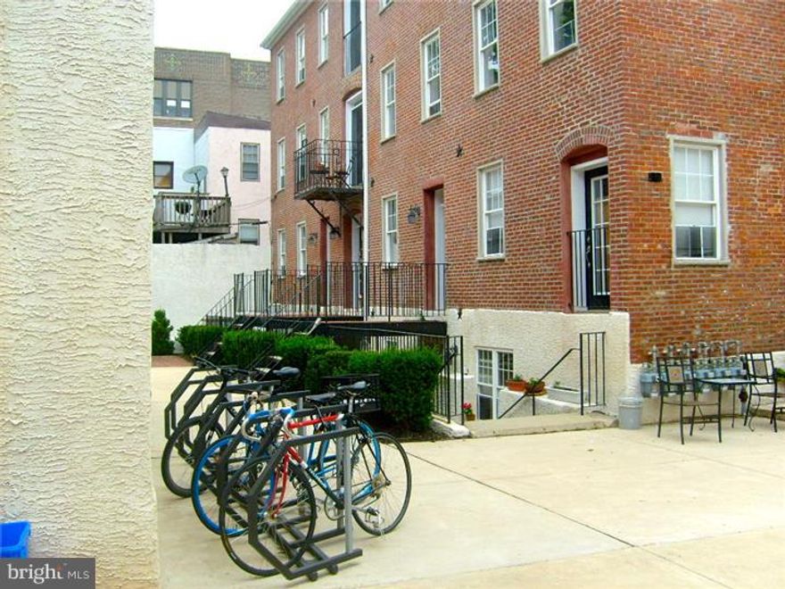 Nestled in the heart of Northern Liberties, is an affordable 9 year old 1 bedroom trinity that looks like new construction. Low maintenance, beautiful and secure pet friendly, courtyard setting in walking distance to all of the fun social venues that the neighborhood has to offer. This cozy condo offers low condo dues, low utility bills and all of the creature comforts you desire. Hardwood floors throughout, carpet in the bedroom, and tile in the full bath. The living room is on the entry level and has a video intercom that allows you to see who is at the gate and buzz them in. The beautiful eat-in kitchen with Cherry Wood Cabinetry, Black Polished Granite and Stainless Appliances (gas cooking) are in the lower level. The 2nd floor has the full bath and laundry, and the 3rd floor is the bedroom level with skylight. This is a corner unit so it is flooded with natural light. The common grounds have seating, a grill and is reminiscent of a European courtyard paved in cobblestone. Great for someone looking for low maintenance living in a premier location. Welcome to Cobblestone Court.