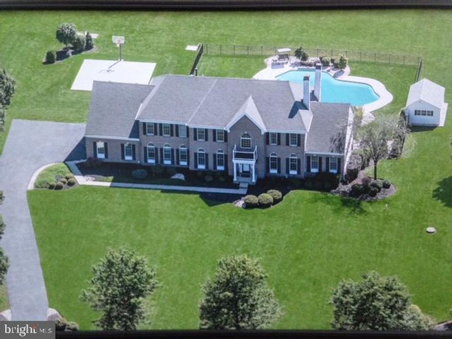 Spectacular Property in beautiful community of Wrightstown Hunt - Don't Miss Out.  Bookmark as a must see.  This home defines LOCATION, LOCATION, LOCATION! Expansive 6 bedroom, 5.5 bath estate home with 3 stop elevator on one of the most beautiful lots in Bucks County. Home sits on 3 lush acres  and backs up to a 40 acre horse farm. With rear southern exposure, enjoy the sun all day while swimming in the large, freeform Anthony and Sylvan inground pool. Relax on the rear deck or owners suite balcony with morning coffee or evening cocktails enjoying sunrises/sunsets all while watching the horse feed and play. This home offers a large owner's suite with a gas fireplace, sitting area and private bath on the second floor along with three additional bedrooms upstairs. A second En-suite bedroom with double-sided gas fireplace is located on the first floor and is ideal for in-laws or a nanny. The sixth bedroom is located in the 2,500 square foot, walk-out, finished basement and is adjacent to a huge, full, custom bath. There is a third gas fireplace in the game/bar area of the basement. This home also offers a private  office for those who work from home along with a second floor bonus room presently being utilized as a virtual teaching/learning classroom. There is a professionally equipped fitness room in the basement (equipment negotiable) along with a full bar and game room including shuffleboard, pool, air hockey and ping-pong tables (all negotiable). Let us not forget the bright and airy sunroom off the kitchen overlooking this magnificent property. This home is equipped with a whole house, fully automatic, backup generator so you are never without power.  3 story spiral staircase, 3 car garage and your own basketball court complete this home.   Pool completely renovated May 2020 including new tile, coping, filtration system and natural gas heater. 3 zone heating and air conditioning systems all updated/replaced in 2017. Water filtration and softening system replaced June 2020. Roof replaced March 2021.  Wonderful  shopping and dining experiences near-by in Newtown, New Hope and Doylestown.  Historic Bucks County living offers many amazing experiences from  Antiques, the Arts, Entertainment, History and so much more.