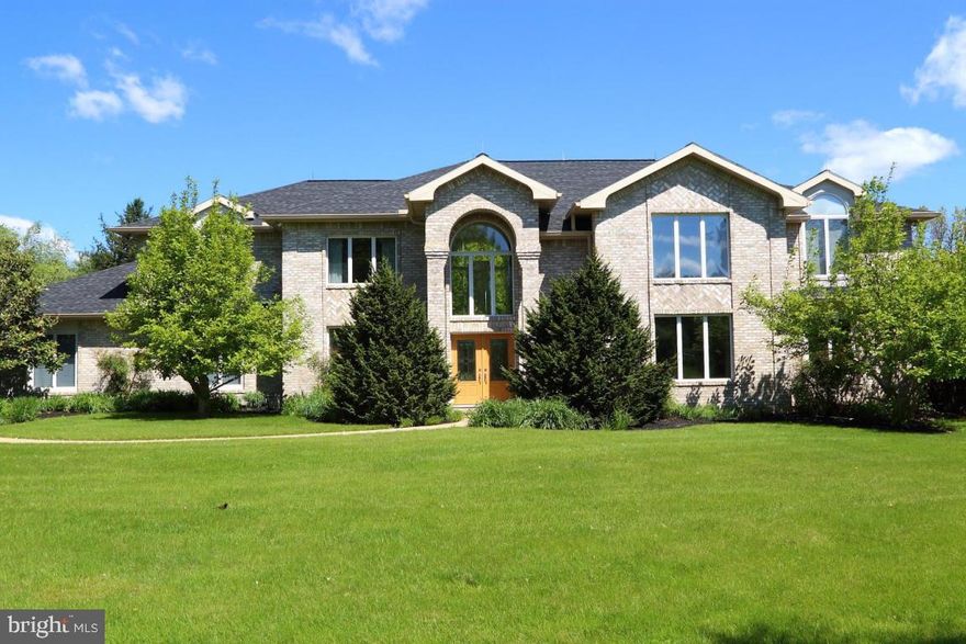 One of a kind home in excellent condition. Large bedrooms. Very open floor plan with sitting rm, library/office, dining rm, living rm, and family rm with wall of windows that overlooks the pool. Screened porch and deck overlooking almost 5 acres of land. Two story fireplaces in living rm and family rm. JennAir black appliances. Solid surface countertops. Wine storage. Lots of storage in this home on both floors. Partially finished basement.