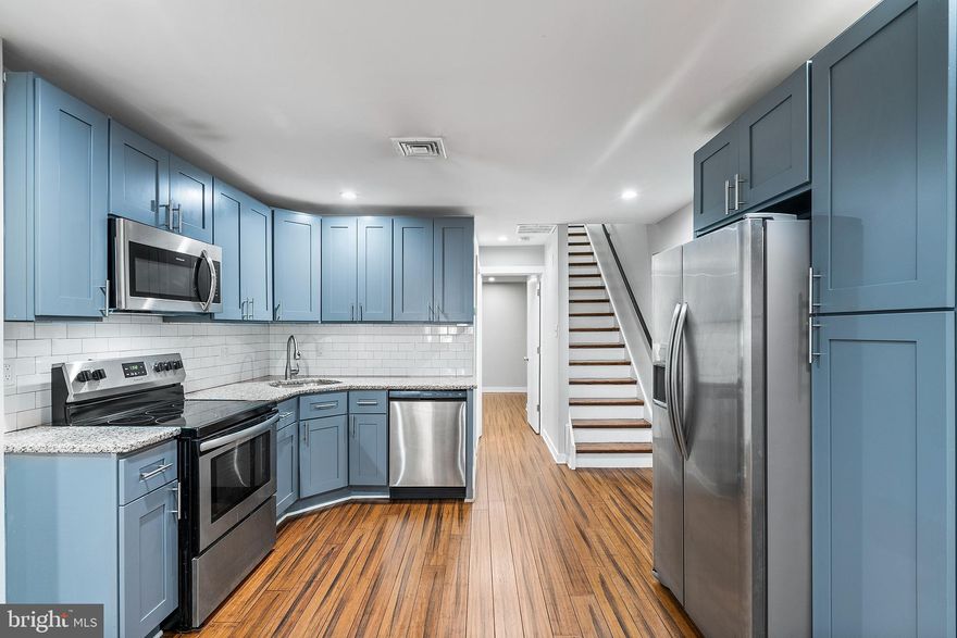 **AVAILABLE 8/1/23** Welcome to 2125 N 20th apartment #1. Recently renovated, this unique 3 bedroom, 2 bathroom bi-level apartment checks every box, while being anything but cookie-cutter. Upon entering unit #1 you're greeted with gleaming wood floors and an open living room and kitchen flow. The kitchen has blue shaker cabinetry, an abundance of counter space and pristine stainless steel appliances. Beyond the kitchen is a full bathroom with double sinks, tub and subway tile. Bedroom number one  and two are on this level, both with closets and an abundance of natural light. The back patio (shared with unit #2) can also be accessed through bedroom 2. Upstairs is the third bedroom and another full bathroom, this one complete with a bath tub and trendy tile. The stacked washer and dryer is also conveniently located on this floor, accessible to all! This is the perfect layout for roommates or someone looking for designated office and workout spaces in addition to their bedroom and living room. Say goodbye to high-rise living. With only two units in the building, this apartment is private and convenient. There is a large communal backyard (shared with unit #2), just waiting for bbq's and some party lights. All this within a 10-15 minute walk to Temple University and easy public transportation on the Broad Street line! More public transit options include bus lines that run on either end of the block at Susquehanna and Diamond. Available immediately. Schedule your showing today! **Minimum 630 credit score.**