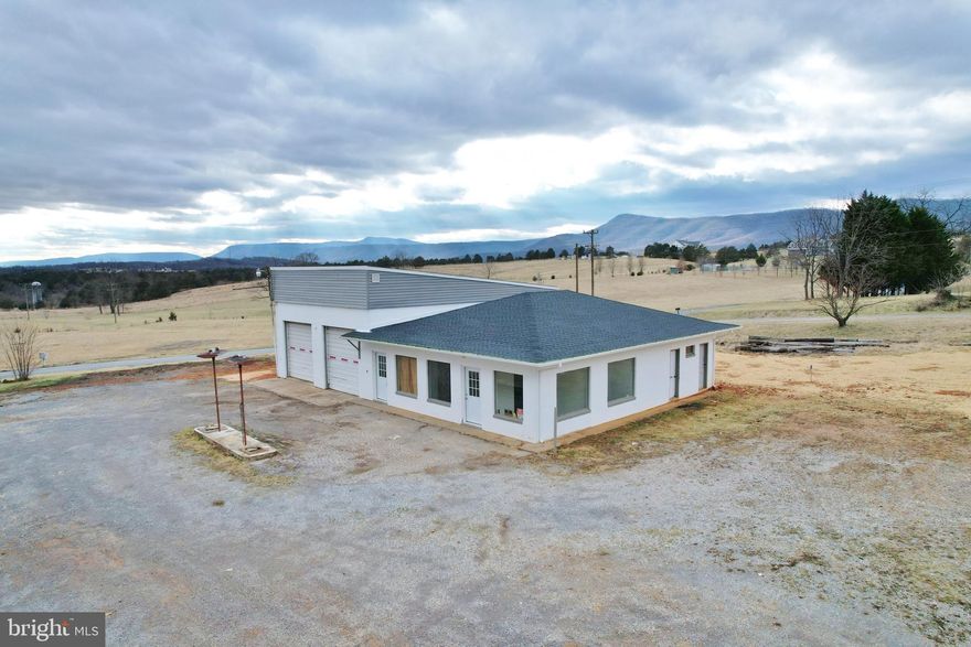 Prime Commercial Opportunity: Mountain Views & Vintage Garage Potential! ⛰️🛠️🍻
Discover an exceptional commercial property boasting breathtaking mountain views 🏔️ and unparalleled exposure on a main road. This unique offering presents a rare blend of vintage charm and modern potential, ideal for a discerning entrepreneur seeking a high-impact location. The centerpiece is a spacious, character-filled vintage-style mechanics garage, ripe for imaginative repurposing.

Envision transforming this expansive space into a thriving microbrewery 🍻, a trendy axe-throwing entertainment venue 🪓🎯, or any number of exciting recreational or commercial ventures. The possibilities are truly limitless! The property's prime location guarantees high visibility and accessibility, ensuring a steady stream of customers. This is more than just a building; it's a canvas for your entrepreneurial vision.

Exceptional Mountain Views: Enjoy stunning panoramic vistas that will captivate clients and employees alike. High-Traffic Location: Benefit from excellent exposure on a major thoroughfare, guaranteeing significant foot and vehicle traffic. Vintage Garage with Endless Potential: A spacious, character-rich building ready for creative transformation into a brewery, entertainment venue, or other commercial enterprise.  Ample Parking: Sufficient parking space to accommodate customers and staff.
Don't miss this extraordinary opportunity to acquire a truly unique commercial property with the potential for exceptional returns. Contact us today to schedule a viewing and explore the endless possibilities! 📞 Property SOLD AS IS.