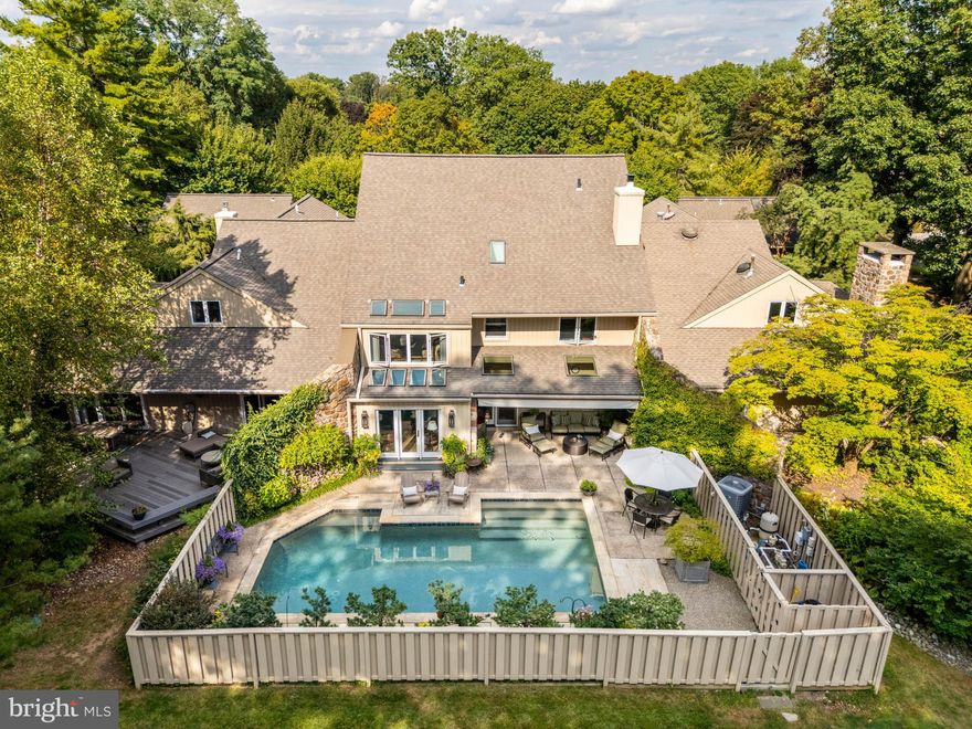 Welcome to 1034 Raffles Lane, an interior unit tucked within the desirable Hermitage neighborhood of Bryn Mawr. This 4-bedroom, 3.5-bath residence offers the perfect balance of privacy, style, and modern convenience in a serene setting.
The main level is thoughtfully designed for both everyday living and entertaining. A light-filled living room with soaring ceilings and a striking stone propane fireplace opens to an oversized dining room and a stylish den. Nearby, the contemporary two-tone kitchen and cozy breakfast room with a second fireplace create warm spaces for casual meals and gatherings. Designer-selected finishes throughout bring a fresh, timeless aesthetic.
Upstairs, you’ll find three spacious bedrooms, including the primary suite with a beautifully renovated ensuite bath and private sitting room. A separate guest suite above the garage offers comfort and privacy for visitors or extended stays.
Outdoors, the home truly shines with a private pool drenched in sunlight, a generous patio for lounging and grilling, and a retractable shade for summer comfort. At the front, a lush, plant-filled courtyard provides a peaceful retreat that feels like your own secret garden.
Tucked in a quiet corner of the Hermitage community, this home combines tranquil living with convenient access to everything Bryn Mawr and the Main Line have to offer.
1034 Raffles Lane isn’t just a home—it’s a lifestyle of comfort, beauty, and ease.