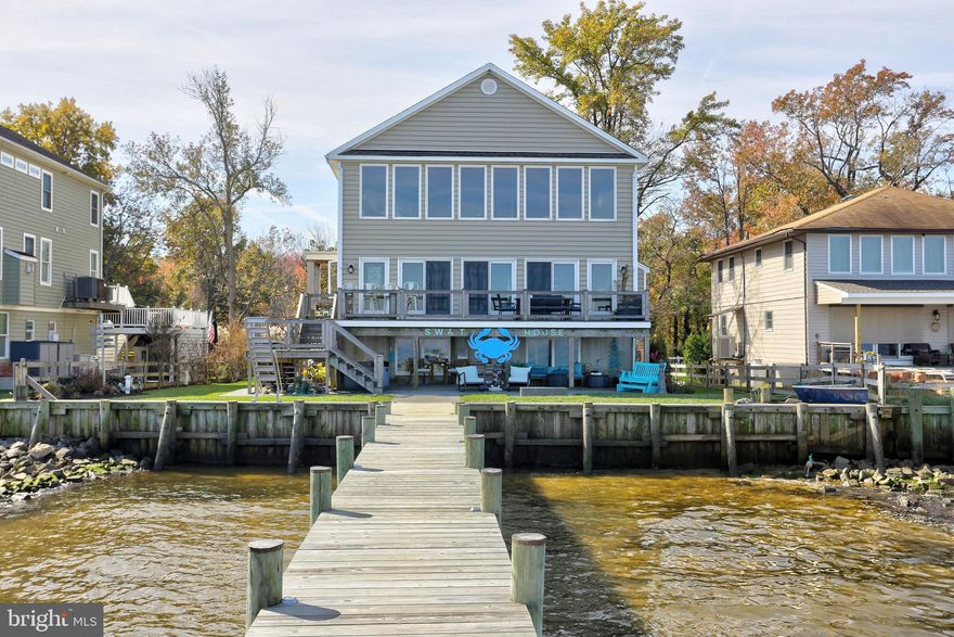 BACK ON THE MARKET!!. Imagine being on vacation all year long with a180° view of the Chesapeake Bay! Welcome to Venice on the Bay! 75 feet of waterfront with a beautiful pier.   The living room has two-story windows to bring the beauty of the bay inside the house. Enjoy working in the gourmet kitchen while watching the ships go by.  Viking cooktop, Wolf oven! The main level includes the living room, dining room, kitchen, two bedrooms, a full bath and a powder room..  The upstairs primary bedroom has a cathedral ceiling, its own bath, walk-in closet and laundry. Just outside the primary bedroom is a large "cat walk" that overlooks the living room and looks directly out onto the bay!  This "cat walk" is used as an office and library.  The unfinished lower level has a 9 foot ceiling, so would be ideal for extra rooms.  Fenced yard and extensive plantings with an automatic, underground watering system, hardscaping & numerous decks 1/13/24 awaiting contract release