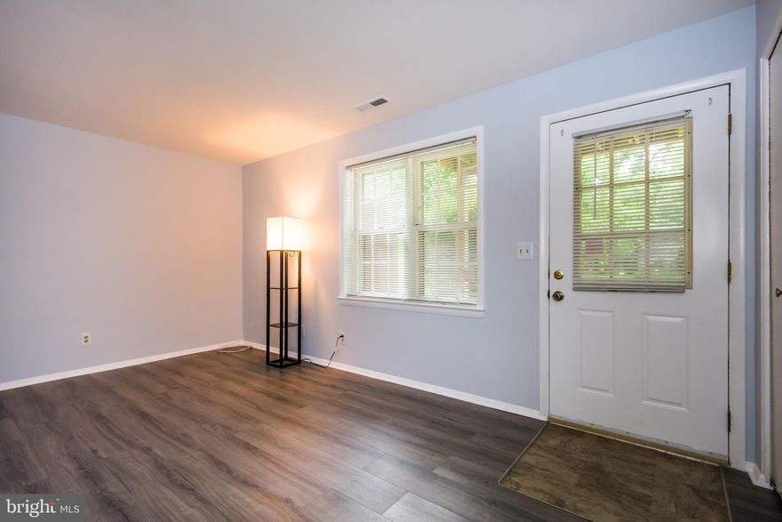 Tucked away off Reisterstown Rd., this rear facing Condo offers covered  front entry patio with park-like views! Featuring Bright Freshly painted rooms, New Laminate wood floors throughout & New Heat & AC in 2022!  Spacious Living/Dining Combo w/galley kitchen  offers Gas range & includes stackable Washer/Dryer! Private condo community pool, & more! Must see! Close proximity to Franklin Blvd w/access to I-795, shopping, dining & More! 
*NOT FHA LENDER APPROVED*