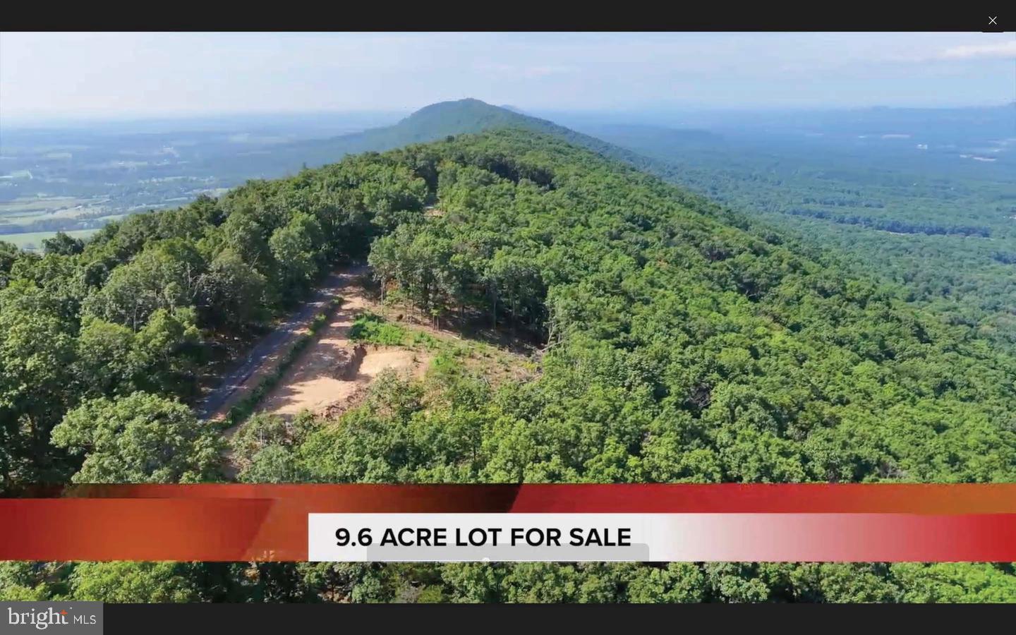 WOW, PANORAMIC VIEW OF WEST SIDE OF THE TUSCARORA RIDGE, EAST VIEW JUST A FEW STEPS AWAY ACROSS THE PAVED ROAD TO SEE THE CITY LIGHTS AT NIGHT! 9.6 Acres off of Tuscarora Pike, at the TOP of the mountain on Radio Tower Road, just past existing home 390 Radio Tower Rd., Hedgesville, WV 25427. Only 3 neighbors pass your new property farther in, privacy, peace and quiet at its finest! Wildlife abundant, yet 5.5 miles from I-81, clear cell phone service. With limited restrictions of no mobile homes or long term camper living, the opportunities are endless. Parcel has approved perc test. Make the last of the Mountain View yours, as they say "they don't make any more of it"!