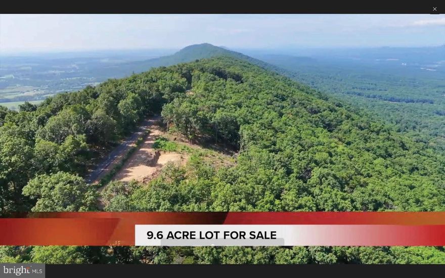 WOW, PANORAMIC VIEW OF WEST SIDE OF THE TUSCARORA RIDGE, EAST VIEW JUST A FEW STEPS AWAY ACROSS THE PAVED ROAD TO SEE THE CITY LIGHTS AT NIGHT! 9.6 Acres off of Tuscarora Pike, at the TOP of the mountain on Radio Tower Road, just past existing home 390 Radio Tower Rd., Hedgesville, WV 25427. Only 3 neighbors pass your new property farther in, privacy, peace and quiet at its finest! Wildlife abundant, yet 5.5 miles from I-81, clear cell phone service.  With limited restrictions of no mobile homes or long term camper living, the opportunities are endless. Parcel has approved perc test. Make the last of the Mountain View yours, as they say "they don't make any more of it"!