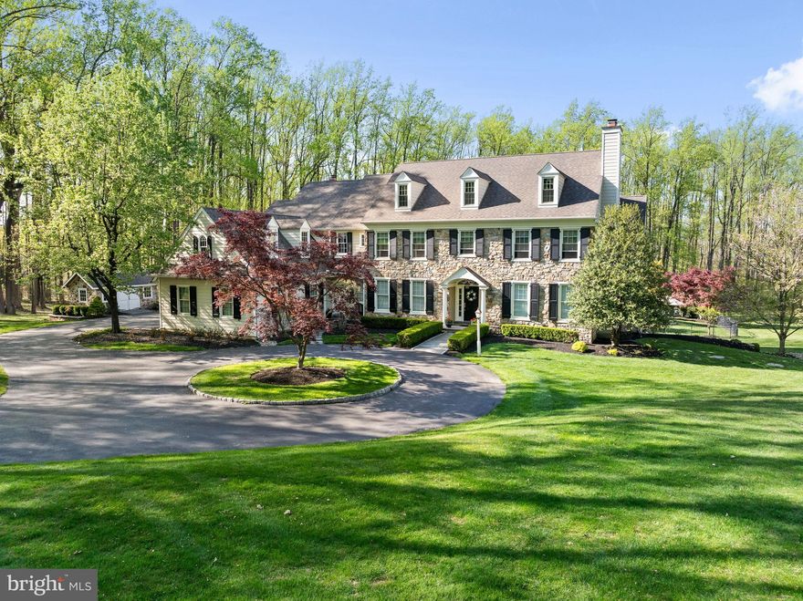 Welcome to 4064 Howell Road, a rare opportunity to own a beautiful custom designed home built by premiere builder Chip Vaughan and situated on 4 breathtaking acres in the community of “Briarwood” in Malvern. This hand-crafted home offers spectacular views from every window and is nestled in a secluded paradise featuring sprawling grounds, mature landscaping, an expansive flagstone patio with cobblestone walkways and a gorgeous inground pool plus a completely renovated exterior in 2021. A circular driveway greets you at the front of the home showcasing over 5,400 square feet of living space in 5 Bedrooms, 3 full Baths and 2 half Baths. Step inside to a grand front-to-back Foyer that sets the tone for a sophisticated yet comfortable floor plan. Extensive custom millwork and rich hardwood floors run throughout the main level including formal Living Room with gas Fireplace, formal Dining Room with box ceiling and wainscoting connected to the Butler’s Pantry with glass cabinetry, wine rack & wine refrigerator. A handsome cherry paneled Study with custom built-ins, recessed lighting and French doors overlooks the spectacular backyard and a formal Powder Room & closet are tucked into the rear front entry area. The heart of the home is the Gourmet Kitchen featuring custom cabinetry, a generous center island, large walk-in pantry, stainless appliances, including Thermador commercial range, and an adjoining light, bright Breakfast Room with tray ceiling and tall windows with transoms that exits onto the rear patio. Adjacent to the Kitchen is the sun-filled Family Room with gas Fireplace, vaulted ceiling and full wall of feature windows. The back Hallway Area offers an informal Powder Room, 2nd front entry door, Mudroom area with custom built-ins, access to the 3-car garage, side entry door & rear staircase to the upper level. 2nd Level features 5 Bedrooms including the Primary Suite with box ceiling, Sitting Room & large custom designed walk-in closet with center dressing island plus luxury Primary Bath with corner jetted tub, oversized shower with bench seat, dressing area and separate water closet. The 4 additional Bedrooms include a Princess Suite and Jack ‘n Jill Suite and a large Bonus Room plus one additional (6th) Room ideal as a Gym, Playroom or 2nd Home Office. A convenient large Laundry Room completes the 2nd floor space. The expansive Lower Level offers soaring 9’ ceilings and daylight windows with excellent potential for future customization and provides plenty of storage for the home. The Outdoor Living Space is second to none and offers an ideal oasis for relaxation or entertainment, and a charming shed matching the stone exterior on the home sits near the 3-car garage and offers additional storage space for outdoor items. Don’t miss this spectacular home in the award-winning Great Valley school district, conveniently located to the area’s finest private schools, Great Valley Corporate Center, PA Turnpike and the 202 Corridor to KOP and Center City Philadelphia, Paoli Train Station and minutes from the shopping and restaurants of Malvern and the Philadelphia Main Line.