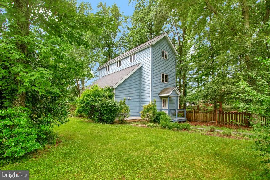 Welcome Home to Annapolis
Experience the coastal charm and vibrant lifestyle of Maryland’s Chesapeake Bay—where boating, sailing, and sunsets on the water are part of everyday life. Nestled within a highly sought-after school district, this light-filled beach-style chalet perfectly blends modern updates with the warmth of a true retreat.
Step through the inviting entryway into a bright, open floor plan. The main-level flex room offers endless possibilities—ideal for a home office, fitness studio, or game lounge. The beautifully remodeled kitchen showcases stunning Calacatta quartz countertops, a navy-and-white cabinetry duo, and stainless-steel appliances. Designed for both family gatherings and weekend entertaining, the kitchen flows seamlessly into the dining area and out onto a spacious deck overlooking more than half an acre of private, tree-lined yard—perfect for cookouts, bonfires, and starlit evenings by the outdoor fireplace.
When it’s time to unwind, retreat to four oversized bedrooms offering plenty of room to relax and recharge. From its thoughtful design to its serene setting, this Annapolis home captures everything you’ve been searching for in your next chapter. Schedule your private tour today and come see why life is better by the Bay.