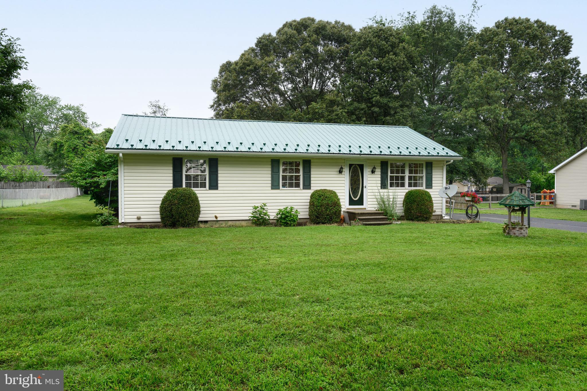 Welcome to this cute-as-a-button home in the water-access community of Chester Harbor! Whether you're starting out, downsizing, or simply looking to simplify your lifestyle, this move-in ready gem offers the perfect balance of comfort, convenience, and charm. Set on a spacious third of an acre lot, this home offers just the right amount of space—three bedrooms, one full bath, and room to grow both inside and out. Recent updates over the past few years take the worry out of homeownership: enjoy low maintenance living with newer flooring throughout, a durable and stylish metal standing seam roof, a generously sized HVAC system for year-round comfort, and freshly sealed asphalt driveway. Step out back to a deck that’s just calling for summer barbecues, crab feasts, or quiet evenings under the stars. A large two-bay shed with electric is the perfect place to store tools, bikes, or gear for all your hobbies. The manageable yard offers green space without hours of upkeep—ideal for pets, gardening, or a game of catch. Located just minutes from downtown Chestertown, shops, restaurants, and the water, this home blends quiet community living with everyday convenience. Best of all, there's no HOA—giving you flexibility and freedom without extra fees. Don’t miss this opportunity to own your own home in a well-loved neighborhood at an approachable price point. Low maintenance, move-in ready, and full of potential—this is the one you've been waiting for!