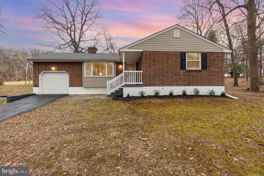 BACK ON THE MARKET!!
This brick 3-bedroom, 2 full bath home nestled in a rural setting has been fully renovated. A newly redone black top driveway leads to 2.07 acres of land. The home offers a bright and cozy living room with a wood burning fireplace, an updated eat-in kitchen with stainless steel refrigerator, stove, built-in microwave, and newly installed white shaker cabinets and luxury vinyl flooring. A complete bathroom with a tiled shower is located in the primary bedroom. Two other bedrooms and another completely updated bath are located on the first floor. The original hardwood floors have been refurbished, the walls have been freshly painted, and new interior doors and updated fixtures add to the appeal of this home.  The lower level presents a large finished open area with recessed lighting, new carpeting, an additional multi-purpose room, and a large laundry room with a new washer and dryer and utility tub. There is an outside walk-up and a new French drain has been installed. New water heater. Lennox HVAC system. The attached garage, with access to the kitchen, has a new door and the walls and floor have received a fresh coat of paint.
The outside of the home has been updated with a new roof, new vinyl siding, and vinyl railing on the front porch. There is plenty of room to entertain on the back covered patio with a cement foundation and vinyl railings overlooking your acreage. An additional large garage with a loft and electricity is perfect for storage and other many other hobbies/uses. The garage has received a make-over on the exterior and a new garage door has been ordered and will be installed.
This property is located in the northwestern portion of Maryland’s Eastern Shore, about one mile south of the Maryland-Pennsylvania border, east of the Susquehanna River and north of US-1. The home is about 1.5 miles northwest of the town of Rising sun and about 4 miles northeast of Conowingo Dam.
