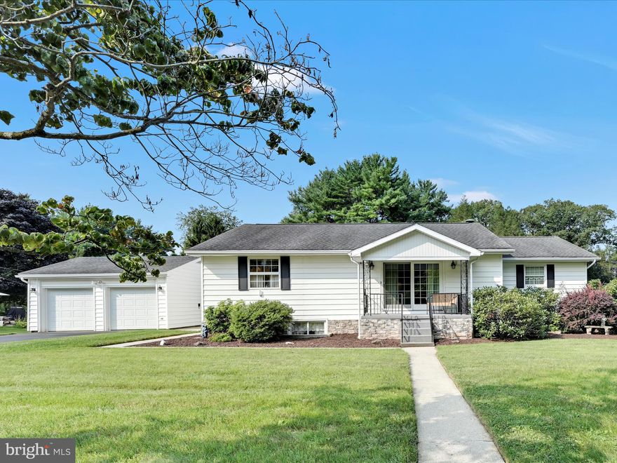 Welcome to this meticulously maintained ranch home, offering the convenience of true one-floor living combined with a spacious lower level. This charming 3-bedroom, 1.5-bath residence boasts 1,524 square feet of thoughtfully designed living space. The primary floor of this residence offers a cohesive and well-appointed layout. The combination living and dining room serves as a spacious area suitable for both leisure and formal entertaining, with a propane fireplace providing a central element. The galley kitchen is configured for efficiency, featuring a wall oven and electric stovetop, and is supplemented by custom built-ins that include a breakfast bar and a bench with integrated storage. Each of the three bedrooms is generously proportioned and equipped with closet space. The first-floor full bathroom has been remodeled. The living area is significantly extended by a walk-out lower level, which comprises a large family room furnished with a bar, ideal for social gatherings. This level also includes a half bathroom, a dedicated laundry room, and a versatile bonus room that may be utilized as a fourth bedroom, home office, or fitness area. The property is situated on a 0.69-acre parcel with a park-like setting, offering a serene outdoor environment. The home features a heated 2-car garage and covered porches at both the front and rear, providing sheltered spaces for outdoor enjoyment. There is also a separate outdoor pavilion, designed for hosting outdoor events. The residence's exterior is finished with durable vinyl siding. This home is equipped with a propane heating system and central air conditioning that services both levels. Additional systems include a house generator, radon mitigation system, a water softening system, and a high-efficiency on-demand water heater. This property represents a unique opportunity, providing a combination of comfort, functional space, and a private setting.