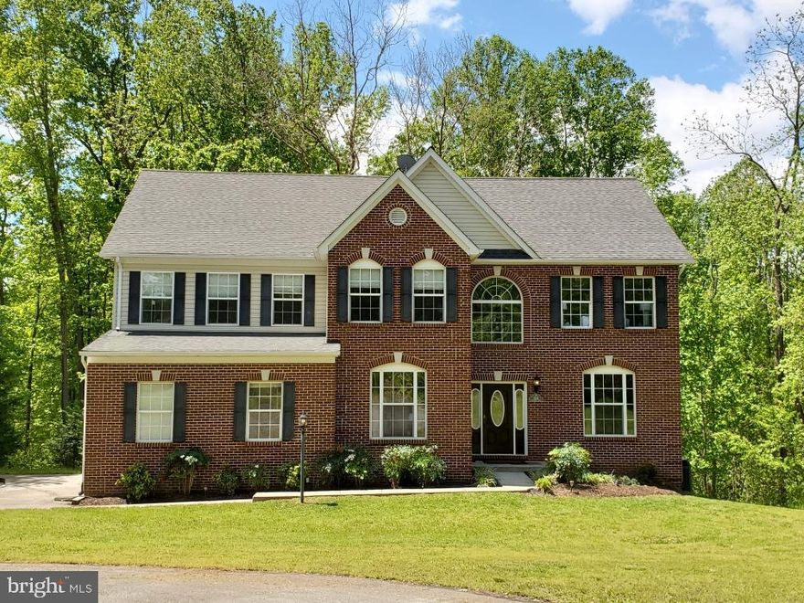 This gorgeous home is nestled on 2 acres of quiet, beautiful private land.  As soon as you walk into this stunning home you are greeted with a large 2 story foyer, hardwood floors and a beautiful double sided staircase. 5535 Fairfield Place boasts 5 bedrooms, 4 full bathrooms and 1 half bath. The extra large master suite has vaulted ceilings, a separate sitting room with built in mini bar, a large walk in closet and a beautiful en suite that  boasts its own 50 gallon hot water heater, 2 vanities, a large jetted tub, separate shower and separate water closet. The upper level also boasts 3 more bedrooms, 2 full bathrooms and a laundry room with a built in ironing board. No more hauling laundry up and down the stairs it's all on the upper level. The main level offers an office with double doors, a formal living room and a formal dining room perfect for holidays and special occasions. The extra large eat in gourmet kitchen has stainless appliances, brand new granite counters, lots of cabinets, a large pantry and is open to the extra large family room complete with high ceilings and a gas fireplace. This home is filled with natural light, as there are lots of large windows and French double doors off the kitchen that lead to one of three decks.  The basement is completely finished and boasts 1 bedroom with a separate dressing room, 1 full bathroom, open kitchen, dining room, living room, separate family/exercise/game room. You can access the basement from inside the home or through a separate entrance that also connects to a deck with a hot tub. This Home has been meticulously cared for and lovingly maintained.  The  property also offers a workshop that is on slab, wired and ready for use. It is measures 18' x 18' x 12'.    5535 Fairfield Place is minutes from commuter options, convenient to DC, Virginia and Southern Maryland.  Plenty of shopping, dining and entertainment close by.  All you have to do is move in and enjoy!Virtual Tour: https://my.matterport.com/show/?m=JZira2tZFBt&mls=1