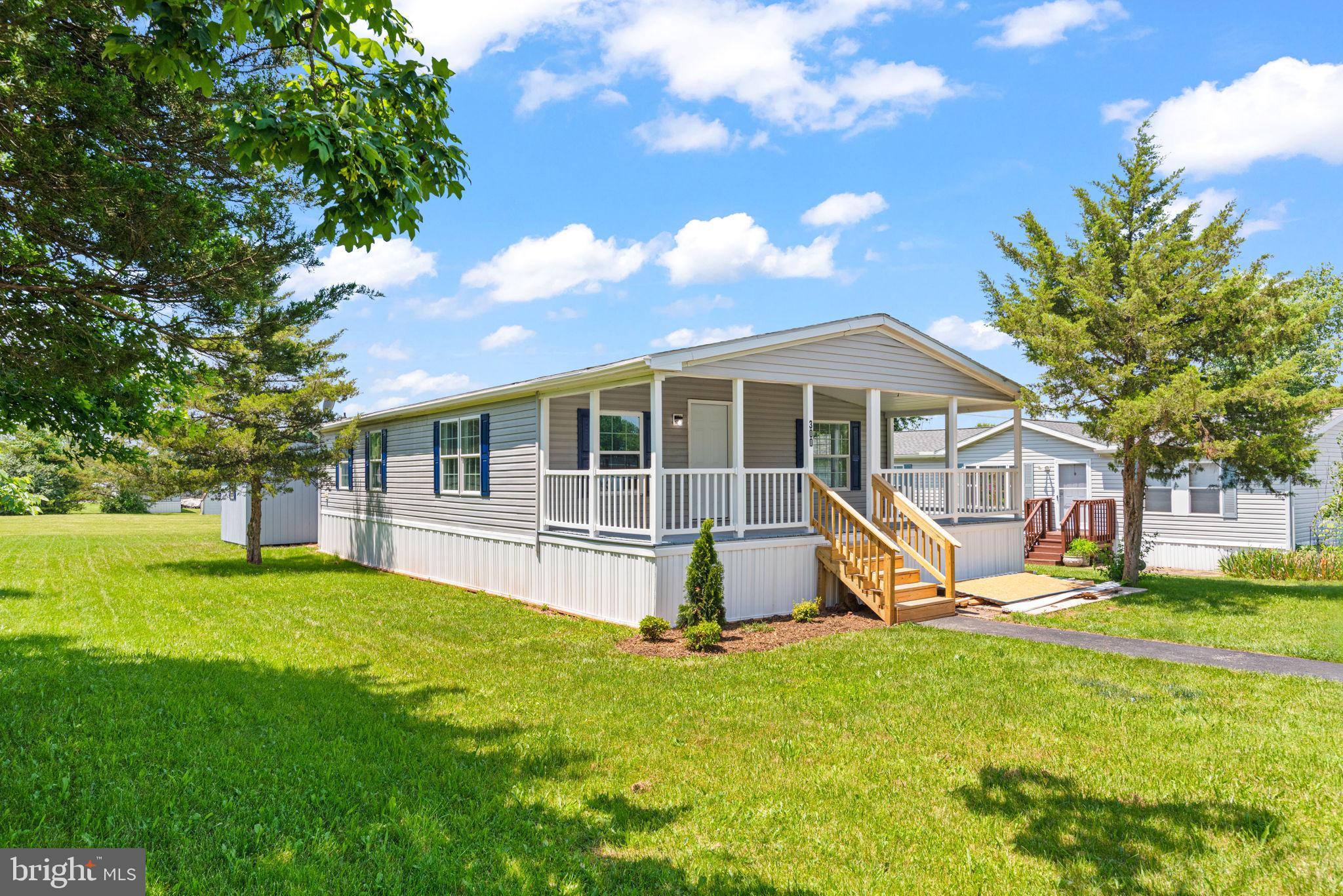 Welcome to 300 Dean Street in Elizabethtown — a completely renovated 2007 mobile home that’s full of charm and modern updates. With 2 bedrooms and 2 full bathrooms, this home offers the perfect blend of comfort and convenience in the sought-after Lower Dauphin School District.
Enjoy peaceful mornings on the spacious covered front porch, or step inside to discover a bright, open layout with fresh finishes throughout. The kitchen has been tastefully updated and opens seamlessly into the living and dining areas, making it great for entertaining. The primary suite features a private bath, and two additional bedrooms offer space for family, guests, or a home office.
This home also boasts a brand-new roof, so you can move in with peace of mind. Located in a quiet, well-maintained community, all offers are contingent upon park approval and lot rent applies. Lot rent for 300 Dean is as follows: $620 base rent plus $15 surcharge makes a base rent of $635 which includes water and trash. There is a separate sewer fee of $60 per month.
Whether you're downsizing, just starting out, or simply looking for low-maintenance living in a great school district — this charming home is ready to welcome you! Don’t miss your chance—schedule your private showing today!