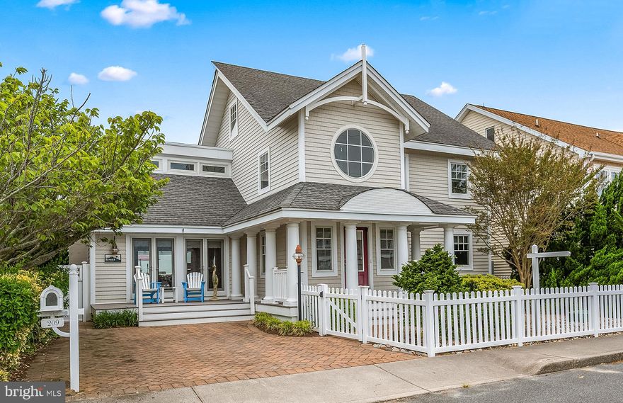 Your beautiful bay front home awaits you with panoramic views. This gorgeous home was re-designed by Becker Morgan architects. Additional square footage was added to the home and plenty of windows, so spectacular views can be seen from the open concept floor plan. There is an expansive bay front deck that measures 45ft x 26ft that has an outdoor TV and a fire pit to enjoy your synthetic deck on beautiful sunny days or a chilly night too. You can walk right out to your boat dock and enjoy a fun day boating or jet skiing on the bay. The Living area has an oversized gas fireplace and stone hearth that reaches up to the ceiling. There are speakers in the living and dining area to play your favorite music.  Recessed lighting and up lighting make for an amazing ambience in your open concept living, dining and kitchen areas. There is a waterfront sunroom that is open to the beautiful bay views. The kitchen is a gourmet chefs delight. The kitchen has all Viking appliances and the range is professional grade with a warming area on top. There is also a full service wet bar with a wine refrigerator. There is plenty of counter space and extra deep custom sink adjoining the breakfast bar. There is a freezer in your large utility room with full size washer and dryer. The home has a security system. Use the outdoor shower to wash off when you come home from the beach.There are ceiling fans throughout the house, and solid wood doors. Direct bay front master suite with private waterfront balcony. A very special feature is a jetted tub overlooking the bay. Large walk-in closet and ensuite master bath with double bowl sinks, glass shower enclosure and toilet with bidet. The 2nd and 3rd bedrooms are located on the 2nd floor. You will notice in the 3rd bedroom that you have a magnificent view out the window facing the street that looks down a wide canal. You take special spiral steps up to the 3rd floor loft which offers plenty of additional room for sleeping and living space. There is plenty of storage throughout. This is the dream home you’ve been waiting for. You can walk to the beach and you are close to restaurants and shopping. Don’t forget on the 4th of July you will be able to see two different sets of fireworks from your large deck.