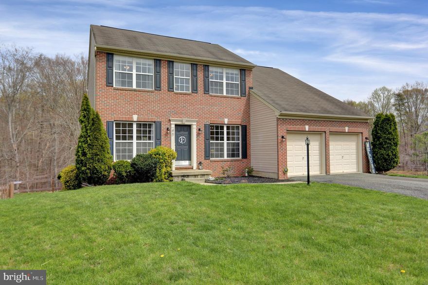 Rarely available brick-front Colonial in Candlelight Ridge.  Situated on a court location backing to trees. The open concept floorplan features hardwood floors throughout the entire main level.
Plenty of areas to relax or entertain...formal living room , formal dining room, and a family room with a gas fireplace opening to the spacious kitchen. You'll love the granite countertops and  large breakfast bar that adjoins the morning room and leads to the rear deck overlooking the fenced backyard and trees. There's also an office/ flex room on this level plus a  powder room. The upper level features four bedrooms and a hall bathroom. The primary bedroom has TWO walk-in closets -AND- a recently renovated bathroom.  The walk-out lower level is spacious and includes a bath rough-in .and is ready for your ideas. One Year AHS Home Warranty included for peace of mind after closing. Schedule your appointment today!