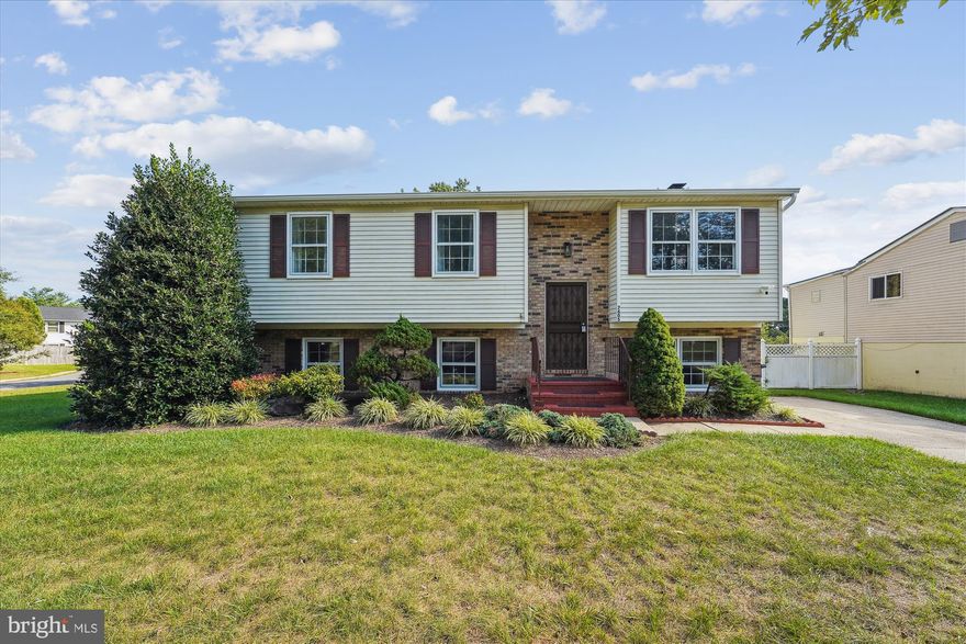 Incredible Opportunity Awaits in Fox Run Estates! Discover this charming 3 bedroom, 3 full bath split foyer home, perfectly nestled on a meticulously landscaped corner lot. Ascend the stairs to be welcomed by a bright and airy living room framed by two windows overlooking the front yard. Freshly painted walls, plush new carpeting, and stylish chair rail adorn the path to the inviting kitchen and dining area. The kitchen boasts all the essentials, wooden cabinetry for your storage needs, and a delightful window overlooking the picturesque backyard. Step out from the dining area onto a sought after three-season screened deck, the ultimate setting for enjoying serene sunrises and sunsets. Down the hallway, you'll find two generously-sized bedrooms, with the second bedroom easily convertible back into two separate rooms to offer a total of three bedrooms upstairs. The roomy primary suite offers ample closet space, serene backyard views, and an en-suite complete with a walk-in shower. The lower level recreation room showcases a stunning floor-to-ceiling brick accent wall, complemented by a cozy wood burning fireplace and bonus electric fireplace. Additionally, the lower level presents a third bedroom and a full bath, ideal for accommodating guests or in-laws. Completing the basement area is a bonus den/office space, perfect for working from home. Slide open the doors to walk out to an enclosed patio area and an enchanting backyard. Embrace the magic of evening fires around the firepit, setting the stage for unforgettable memories that will endure for generations. Recent updates include fresh paint (2023), gutters and downspouts (2022), hall bathtub fixtures (2022), deck enclosure (2020), and toilets (2020).