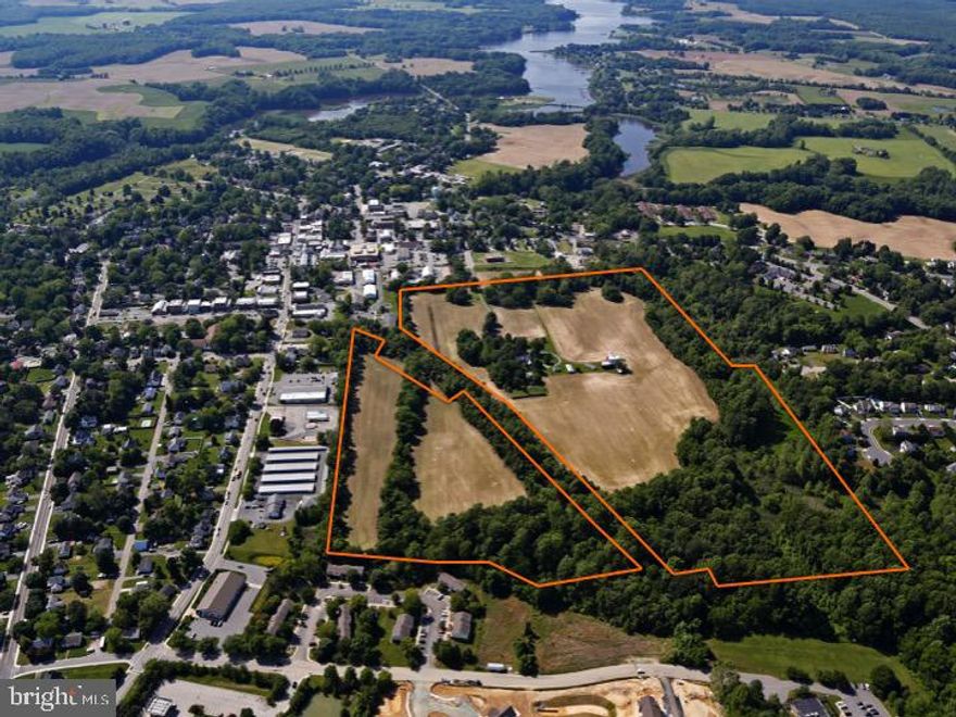 A jewel in Historic Centreville, Locust Hill is 71 acres of prime opportunity! The main farmhouse is a late 18th to early 19th Century Federal-style white clapboard building featuring original details and craftmanship, with later construction adding more modern updates. The property also features a milk house, smoke house, dairy barn, gardens, woodlands, wetlands, and 40 acres of tillable farmland. Zoned in two separate tracts with various uses, the potential in this property is immense. The 57-acre Residential tract is the quintessential Eastern Shore Gentleman's Farm, with future development potential. Possibilities could include dense R-3 zoned development or a minor agricultural neighborhood subdivision with 3-4 large lots offering public water and sewer, shared buildings/barns and common areas for horses and other farm uses. The 14 acre Tract, zoned C-3, allows multiple commercial uses. The location, inside Centreville town limits is convenient to enjoy the shops, restaurants and waterfront, all with easy access to 301 and the Bay Bridge!