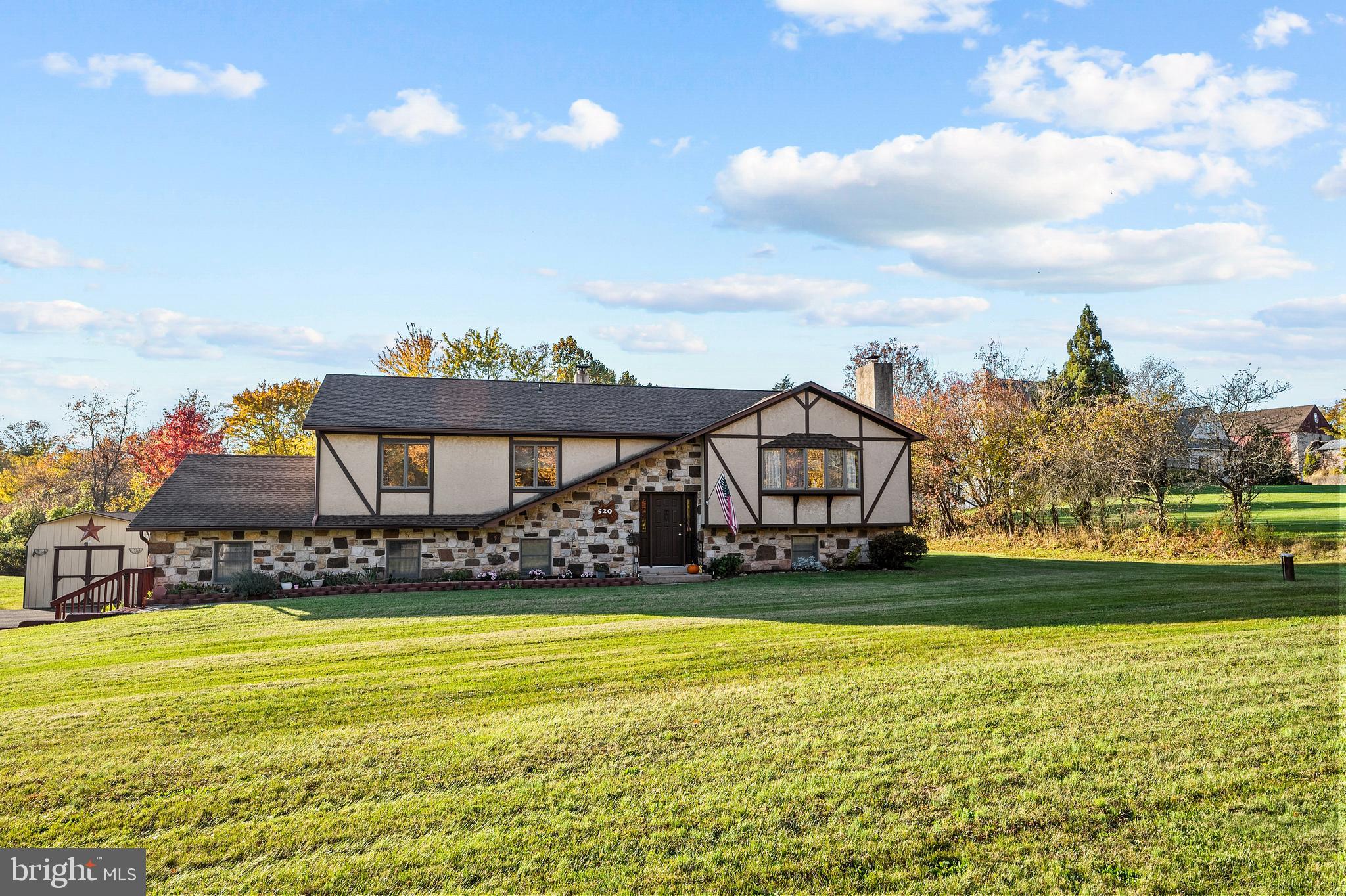 Looking for a place in the country, but not too far from it all? Then check out this stylish home nestled on just under two acres with room to roam inside and out. Set back from the road, you will find something here for everyone in this five bedroom, three bath home with finished walkout lower level. As you enter this modern style home, you will appreciate the care and comforts of home. Main living area features vaulted ceilings with wood beams accenting the space. A stone fireplace with mantle and wood burning insert will take the chill out of any evening in the living room. The kitchen offers breakfast and dining rooms so it’s easy to keep an eye on loved ones or host any friends and family gathering. Dining room leads to the backyard deck, the perfect place to entertain from while running the grill. Great backyard offers room to run and the sights and sounds of nature all year long. Main floor provides wide hallway with first floor laundry for your convenience. Three spacious bedrooms offer plenty of room along with two full bathrooms for privacy and speed in the morning. Walkout finished lower level is the placed to be. Huge family room perfect for movie night or watching the big game. Two more bedrooms and another full bath can be found here too! Plenty of storage space available with two attics and large shed. An expanded driveway offers extra parking. Great location with easy access to major routes, shopping, and golf. So much to offer. Be home before the Holidays!