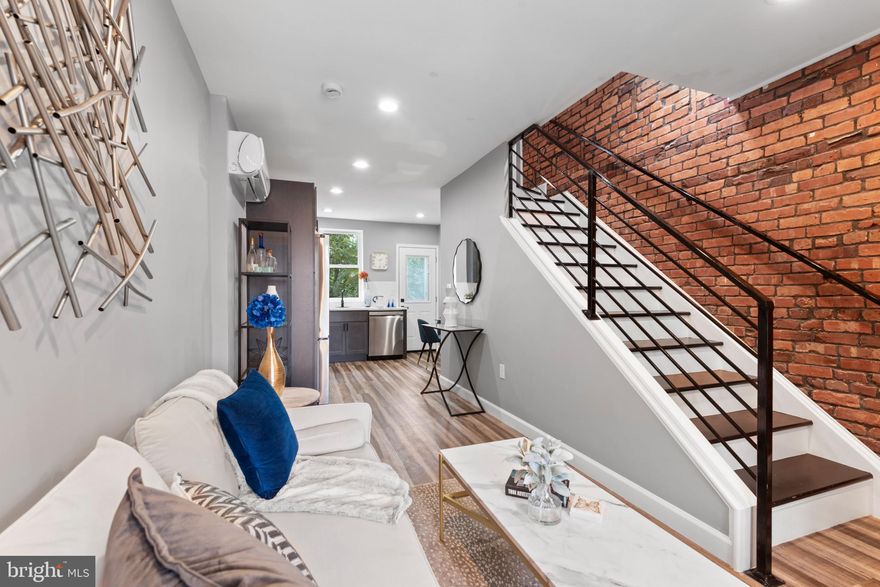 Welcome to your dream home! This beautifully remodeled townhouse features 3 spacious bedrooms and 2 modern bathrooms, offering the perfect blend of comfort and luxury. Every detail has been meticulously updated, ensuring a stylish and functional living space.

The heart of the home is the state-of-the-art kitchen, boasting brand-new stainless-steel appliances that are both energy-efficient and high-performance. Enjoy endless hot water with the tankless water heater, and experience ultimate comfort with individual climate control in each room.

Discover this  Stunning Fully Remodeled Townhouse in vibrant Wyman Park/Hampden—now an unbeatable value! Every inch is turnkey, with high-end finishes and energy-smart upgrades:

Key Highlights
- Price Slashed: Priced well below its recent appraisal 
   your instant equity boost!  
- Closing Assistance: Seller willing to contribute towards your closing costs on a full-price offer.  
- Move-In Ready: All work fully permitted & inspected for your peace of mind.  

Home Features
- 3 Spacious Bedrooms & 2 Sleek Bathrooms
   designer fixtures & luxury vinyl plank flooring  
- Gourmet Kitchen: Brand-new stainless-steel 
     appliances + LG Smart refrigerator  
- Efficient Comfort:Tankless water heater for endless 
    hot water; individual room controls for A/C & heat  
- Smart Security: Wireless camera doorbell for remote 
    monitoring  
- Outdoor Living: Private rear deck + welcoming front 
    porch—perfect for morning coffee or evening unwind  

 Premier Location
- Half-mile to Johns Hopkins University ideal for 
    faculty, grad students, or savvy investors  
- Steps from “The Avenue” boutique shops, cafés, 
    restaurants & nightlife  
- Easy Commute:Quick access to I-83, shuttle routes, 
    bike paths & more  

Don’t let this one slip away! With its jaw-dropping price reduction, high-end remodel and added closing assistance, this gem won't last!