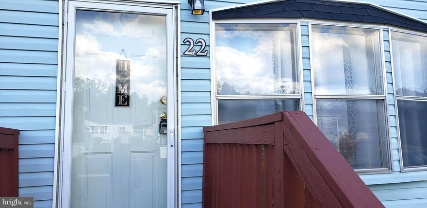 This awesome home is waiting for your finishing touch! It sports an airy, open concept with an actual wood burning fireplace to defy the coming winter nights. Come check out the 2 cozy bedrooms and Owners' with en suite. Complete with jetted soaking tub; this is the place to be after a long day! 
The skylight is a cool plus. The laundry room, complete with washer and dryer, is conveniently located right off the cheery kitchen. Needs dishwasher. Sold as is.

The park is neat, clean, well maintained and close to everything. There's even a Lake! 
It's just minutes from Camden yards and Ravens Stadium.
 Delaware and all it has to offer is just a few exits away!                                                                                           
Newer roof, all appliances less than ten years old, newer furnace  and, one of the largest decks in the park makes this one a no brainer.
Prospective owners must make application to Reeds Run Park. Park rent is 670.00 per month.
Welcome home!