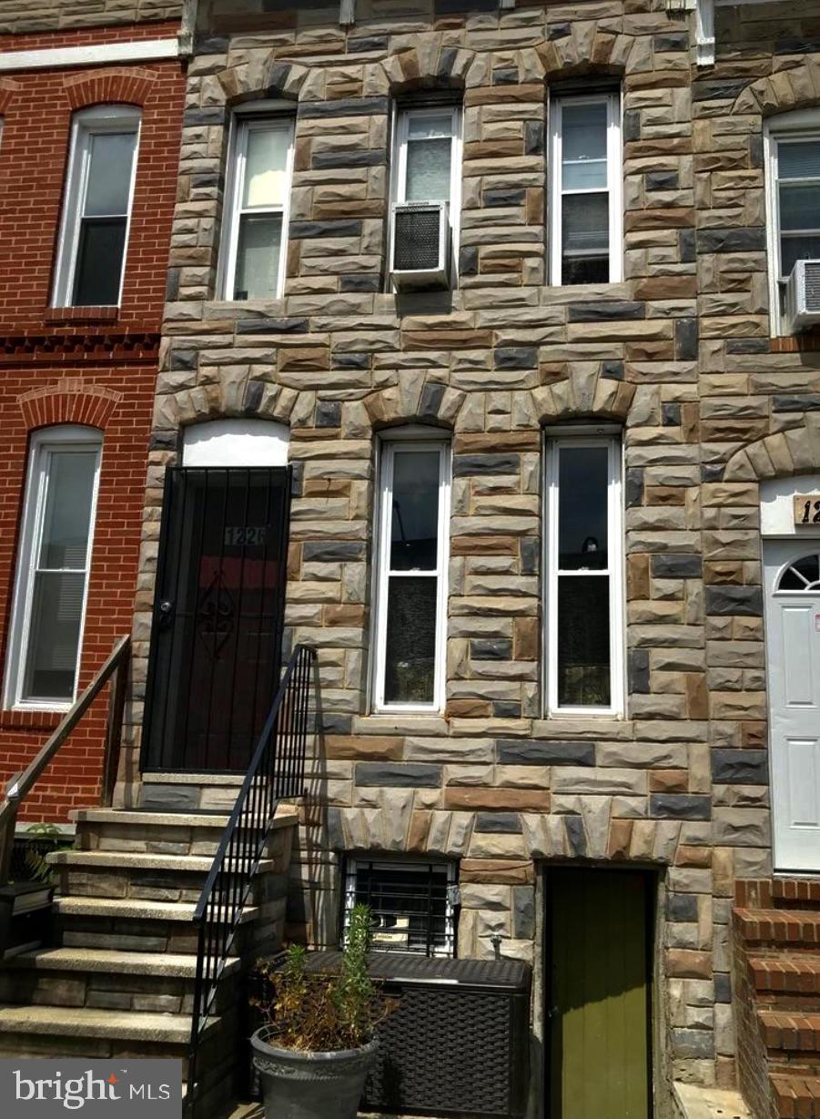 INVESTOR ALERT! This is a great opportunity for an owner-occupier or future landlord to own a large, contemporary 3 unit furnished townhome with private entrances in a fabulous sought after "Air BnB location." Boasting 3 a total of approx 1,600 sqft. This light-filled bldg. has off-street parking, and no HOA. Most recent renovations include 2021, updated electric, plumbing, new drywall, flooring, newly enclosed sunroom w/ heat & a/c provides an extra useful 240 sq. ft.. This home has 9-foot ceilings, and has been refreshed for a new owner with a potential rental earning over $3k/mo when fully occupied, with potential for more. The flexible floor plan includes 3 bedrooms, and 3 full bathrooms, one on each floor. The eat-in kitchen has granite counters and S/S appliances. A finished basement with a studio apt. & separate front entrance. The 1 car off-street attached heated parking pad has concrete walls and foam insulation. There is ample street parking, making this a truly convenient home. Square footage is approximate; it includes newly enclosed sunroom & the lower level which differs from the tax record, so exact measurements to be verified by buyers. Public transit nearby & just a few blocks from the University of Maryland, M&T Raven Stadium, Oriole Park Camden Yards, HorseShoe Casino, B&O Railroad Museum to name a few.