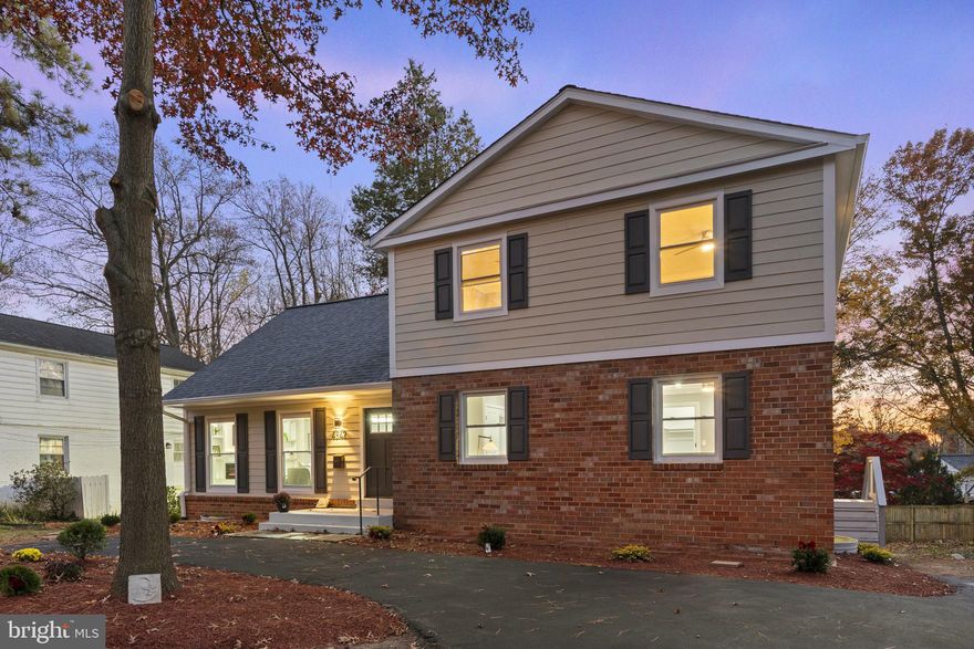 Welcome to 4942 Bel Pre Rd, a stunning fully renovated single-family home nestled in the desirable community of Manor Woods in Rockville, MD. Boasting 6 bedrooms, 4 full bathrooms, and 2 half bathrooms, this property offers an unparalleled blend of modern luxury and timeless elegance.

As you step into the main level, you are greeted by an inviting open concept living room, dining room, and gourmet kitchen. The eat-in kitchen is a chef's dream with quartz countertops, new stainless steel appliances, custom cabinetry providing ample storage, and a tasteful tile backsplash. The adjacent large sunroom offers a perfect retreat, and a main level office with frosted glass French doors provides a quiet space for work or study. A main level bedroom with a walk-in closet and a full en-suite bathroom adds convenience and flexibility to the floor plan. The main level is completed by a powder room and a well-appointed mud/laundry space off the side entrance.

Upstairs, the spacious primary suite awaits, featuring a modern full bathroom with a double vanity and a luxurious soaking tub. The primary bedroom also includes a walk-in closet and large storage space. Three additional generously sized bedrooms on the upper level share a beautiful full bathroom.

The walkout basement is flooded with natural light and offers a large recreational space and family room. A bedroom with an egress window, a full bathroom, a fitness room, a powder room, and a separate laundry area complete the lower level, providing additional living space for entertainment and relaxation.

No expense was spared in the renovation of this home, with upgrades including a new roof, Hardie board siding, energy-efficient windows, upgraded attic and wall insulation, luxury vinyl plank floors throughout, wifi-controlled recessed lighting, and stylish electric fireplaces on three levels.

Step outside to the newly poured concrete patio and large deck off the sunroom, perfect for enjoying the outdoors and entertaining guests. The property is conveniently located near Rockville and Olney, with easy access to MD-200. Explore local recreational areas such as Lake Frank, private and public golf courses, as well as a variety of restaurants and shopping options just minutes away.

Don't miss the opportunity to make this meticulously renovated property your new home – a perfect blend of modern comfort and classic charm in a prime Rockville location. Schedule your showing today!