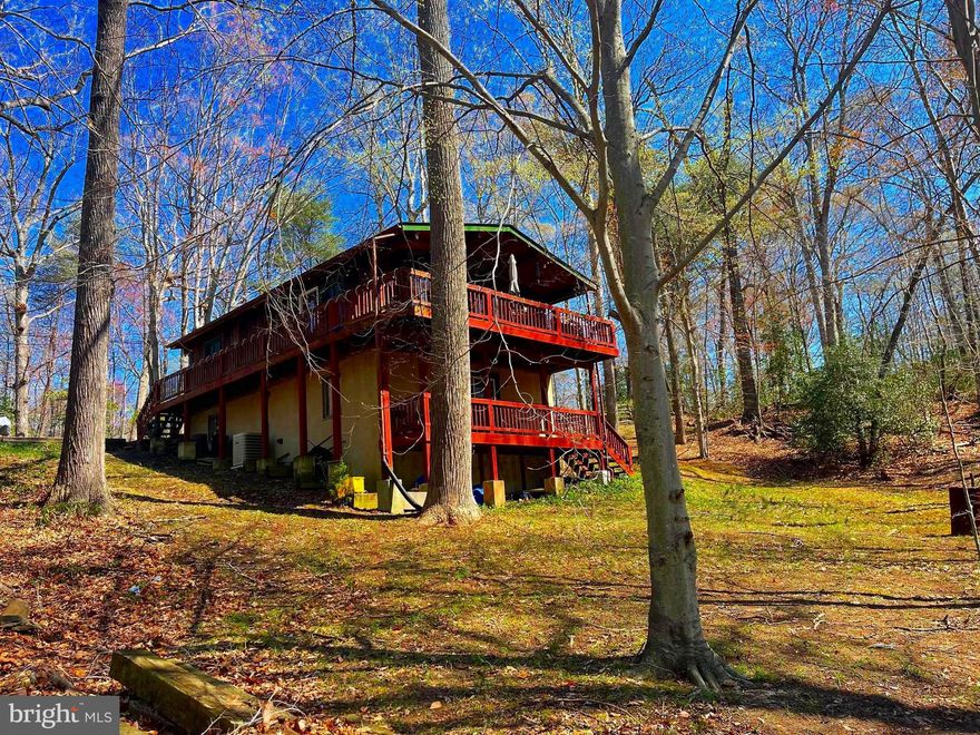 This two level unique cabin style home is conveniently located an hour and a half out of Washington D.C. and 15 minutes from Solomons Island, Maryland. A short distance to many water oriented activities, dining,  and the Calvert Marine Museum.  Enjoy your coffee on the back deck while looking at the beautiful trees.  An abundance of natural light flows into the living room area with plank ceilings. Two nicely sized bedrooms and one bath are located on the main level. One bedroom and the potential for a second bedroom in the partial finished basement area.  A new roof was installed 5 years ago as well as a new septic/BAT system. Chesapeake Ranch Estates has a lake, beaches, and play areas.  Come take a peak at this adorable home just in time for summer.