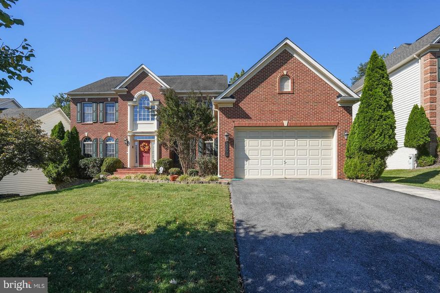 BACK ON THE MARKET!!….with Brand New Roof 
Buyer’s loan approval fell through.
This stately Colonial-style home in the distinguished Cross Creek Club community (original owners) offers 5,574 finished square feet, including a fully finished walk-out basement, with 4 bedrooms and 4½ baths, generous room sizes, flexible living spaces, and abundant natural light. An elegant two-story foyer separates the formal living and dining rooms, with the dining room showcasing tray ceilings, chair railing, and columns, while hardwood floors span the main level. The gourmet kitchen features Corian countertops, ceramic tile floors, upgraded stainless steel appliances including a double wall oven, a large center island with extra cabinetry, an eat-in area seating six, and a spacious butler’s pantry, opening to a private wooded backyard with double deck, brick patio, and concrete sport court. Adjacent is a dramatic family room with cathedral ceiling, fireplace, and secondary staircase, making the main level ideal for entertaining, complemented by a private office with French doors and a powder room. Upstairs, the expansive primary suite includes a tray ceiling, sitting area, dual walk-in closets, and a renovated spa-like bath, while three additional bedrooms include one en suite and two connected by a Jack-and-Jill bath. The lower level offers a wet bar, full bath, bonus room, ample storage, and outdoor access. Additional highlights include a new sump pump, deep two-car garage with updated motor and extended parking, a full-yard sprinkler system, and access to HOA amenities such as pool, tennis courts, walking paths, and nearby parkland, all conveniently located near major commuter routes and shopping in one of Silver Spring’s most coveted neighborhoods.