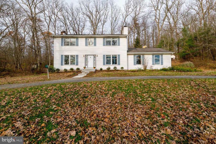 Enjoy the view of the rolling hills and working farm from your newly installed front windows on this private 2 acre lot in the highly desirable Hereford School Zone.  Beautiful hardwood floors on the main and upper levels, an attached 2 car garage and a fully finished basement with a potential 4th bedroom or office/virtual learning space. Wood burning fireplaces in the living room, family room and Master bedroom for extra warmth and ambience.  Access the beautiful sunroom off the Living Room to enjoy the views of nature and outdoor deck space.  Deck and rear yard backs to conservation which adds to the serenity of this special property. Don't miss this opportunity to create your dream home.  Home is being sold "As Is" but sellers are offering a one year home warranty.