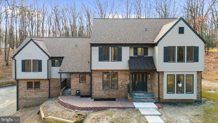 Welcome to 1439 Dicus Mill Road — a truly one-of-a-kind opportunity to start 2026 off right in a home that rarely comes along in this area: a fully renovated, move-in ready modern farmhouse-style colonial on a 2-acre, tree-lined lot, featuring 7 bedrooms, 4.5 bathrooms plus office, 3,545 sq ft above grade plus a  1,770 sq ft basement, and a large 2-car garage. Set back from the street overlooking Dicus Mill Road, the property offers a private, tucked-away feel.

This is true turnkey with real peace of mind — not just new finishes, but major updates including updated roofing, plumbing, and electrical, plus three HVAC systems, updated well and septic, and propane installed for the chef’s range. The Stainless Steel chef’s kitchen is fully equipped with a 6 burner gas range with convection and air fry, a built-in microwave, low db dishwasher, large 4-door french door refrigerator, and wine cooler, along with quartz countertops and a farmhouse sink. Designed for comfort and entertaining, the home features two front entrances, a large rear deck, and two modern fireplaces (non-wood burning) — one in the main family room and one in the basement family room. The walkout basement adds incredible flexibility for recreation, guests, multigenerational living, or home gym space. The large primary master suite with walk-in closet, delivers spa-level comfort with a Euro-style double shower, soaking tub, double vanity, and a large linen closet. Even the essentials are done: brand-new washer and dryer are installed. Nothing left to do — just move in and enjoy.

Move-in ready / turnkey + peace of mind
2 acres, tree-lined, set back on a hill
7BR / 4.5BA plus office
3,545 SF above grade +  1,770 SF walkout basement
Large 2-car garage
Large rear deck
Two front entrances
Two modern fireplaces (non-wood burning)
3 HVAC systems
Updated roof / plumbing / electrical
Updated well & septic
Brand-new washer & dryer installed
Chef’s Stainless Steel kitchen: 6 burner gas range,  4-door french door fridge, Built-in Microwave, low db Dishwasher, Wine Cooler, farmhouse sink, and quartz countertops. 
Large Master Suite with Walk-in Closet, Large custom double shower, soaking tub, double vanity, and a large linen closet.