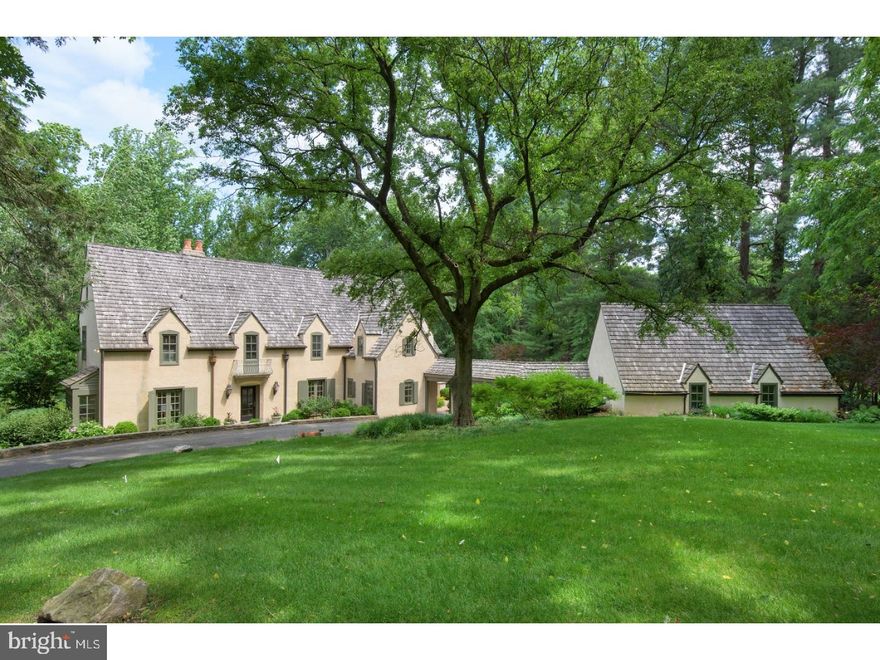 On a cul de sac at the end of a private drive off of Grays Lane, find this classic 4 bedroom, 4.1 Bath country Villa on 1.22 acres. Enter the tiled, open Entrance Hall brightened by southern facing windows & large archways to the formal areas of the house. Walk into the Formal LR which is flooded w/ light from 3 exposures, accented by deep built ins which are perfect for books & varied displays, crown & wall molding & centered on a wood burning brick fp w/ tile surround. The Formal DR is warmed by its brick wood burning fp w/ a carved wood mantles, chair rail & crown molding & naturally lit by the skylight & wall of windows overlooking the terrace in the adjoining Sunroom. The chef's Kitchen provides a spacious island workspace w/ bar stool seating, granite countertops, Sub-Zero Refrigerator, a Thermador double oven & Professional 6 gas range w/ griddle & is highlighted by the Brkfst Rm's large windows. This space flows into the FR which is centered on an elevated hearth w/ tile surround & brought to life by exceptional built-ins brightened by the French doors that lead out to the wrap-around Terrace. The Kit/Fmly Rm is the ideal daily living space that is essential in every modern home. The Main Lvl is completed by a Powder Rm, walk-in Pantry, & Mudroom w/ access to a covered walkway leading to the 3 car Garage. Ascend the formal stair to a bright, wide hall & enter the Master Suite w/ Cathedral ceilings, a gas burning fp, wall to wall carpeting, walk-in closet, & stunning Master Bath expertly designed w/ marble floors, an under window soaking tub, His & Her sinks w/ granite countertop, & sit-down shower w/ a rain shower head. This floor is completed by 3 more family Bdrms, one w/ en suite Bath, while the others share a spacious hall Bath w/ double sink top & abundant cabinetry. The finished Garden Lvl features tiled flooring, a large rm w/ a Screening Area, Gym Area, Indoor Hot Tub & covered porch & pool access. This floor is finished w/ a private 5th Bdrm, currently purposed as a Study, w/ wall to wall carpeting, large built-ins, & an en-suite Bath. Have dinner w/ friends & family on the Garden Lvl porch which enjoys views of the surrounding wood & lush lawns, while being warmly lit by gas burning sconces. Step down to the pool which has a brick lounging area on three sides & abuts to a large outdoor stair that leads to the Garage & upper lvl Terrace. This Southern European styled villa is a one of a kind find in the heart of Haverford.