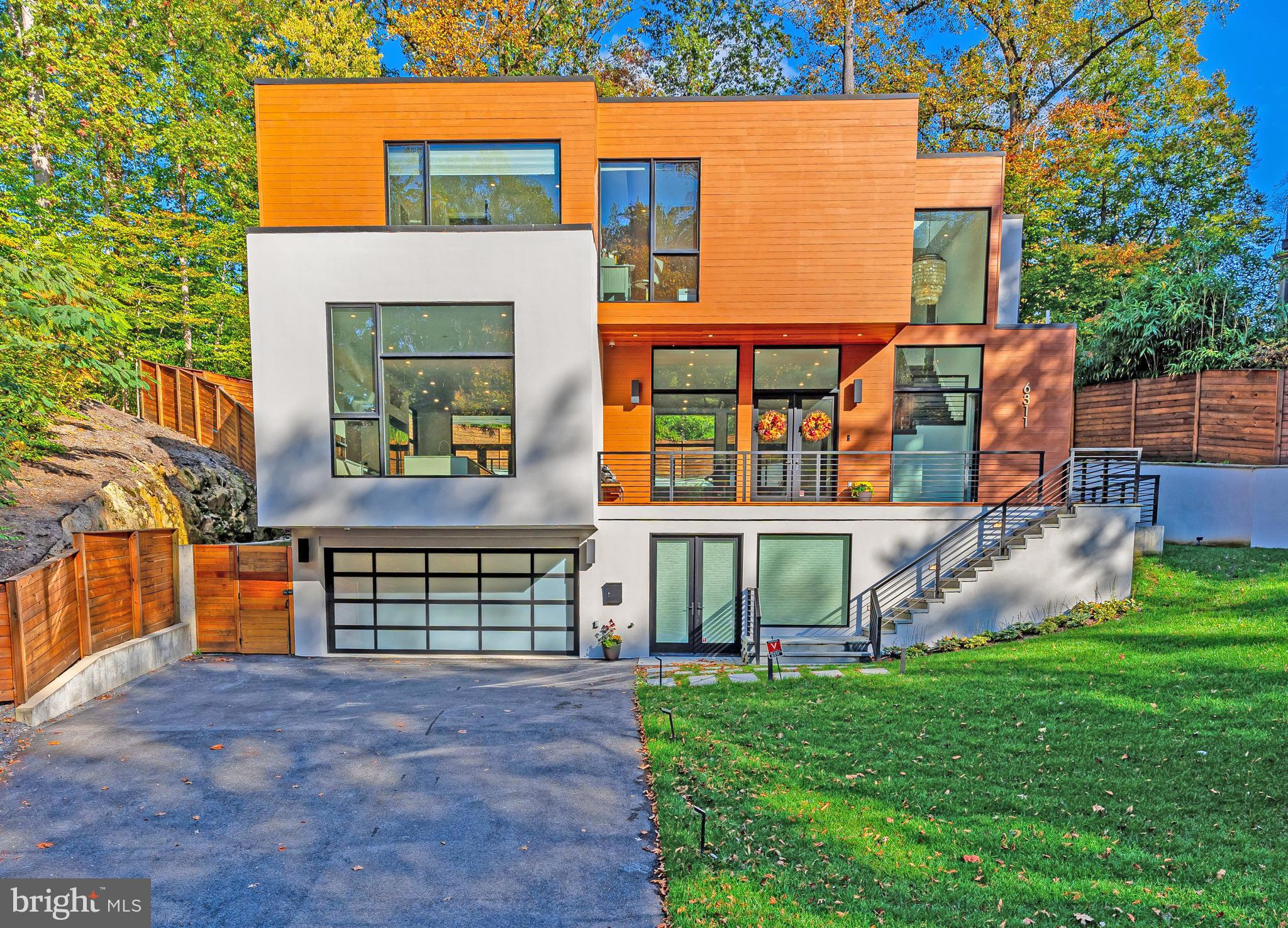 Due to virtual learning, sellers prefer showings on weekdays to be AFTER 3:15 PM. - - NEW on Market! 2017-Built contemporary home featuring clean lines and open spaces, and today's must-have amenities: heated saltwater pool, outdoor shower, elevator to all levels, top-of-the-line appliances (two dishwashers, wine refrigerator), and open floor plan with main level office. Fabulous owner's bedroom suite with private screened porch overlooking the pool, two huge walk-in closets, and a stunning bathroom with heated floors, steam shower and separate tub. The level walk-out lower level is the perfect hang-out a play area (or could be used as an exercise room), a sunlit recreation room with rough-in for bar and future temperature-controlled wine cellar, plus a guest bedroom suite. All just steps from Merrimack Park, 5 minutes to downtown Bethesda, 25 minutes to downtown DC, Dulles and Reagan airports. Wood Acres/ Whitman school cluster.