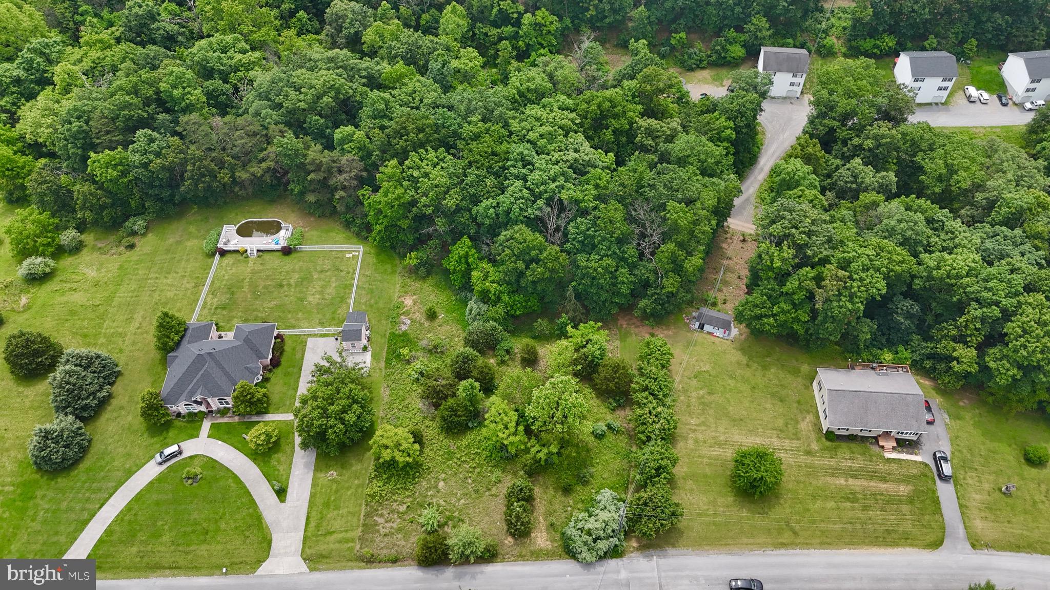 1.04 Acres of Opportunity!
Discover the perfect place to build your dream home on this 1.04-acre unrestricted lot in a peaceful and established Kearneysville neighborhood. Surrounded by beautiful homes and scenic countryside, this property offers the privacy of a natural setting with the flexibility that unrestricted land provides.
Property Features:
Gently sloped terrain - flat in front, gradually sloping toward the back, Wooded and overgrown, offering a blank canvas to clear and shape to your vision, Unrestricted - ideal for those seeking freedom in building or use, Utilities nearby - neighboring homes enjoy wells and septic systems, making development straightforward.
Whether you’re looking to build now or invest for later, this lot holds tremendous potential. With stunning surroundings, space to roam, and no known restrictions, it’s a rare opportunity in Berkeley County! Conveniently located, you don't want to miss this! Schedule an appointment today to go see this great lot!