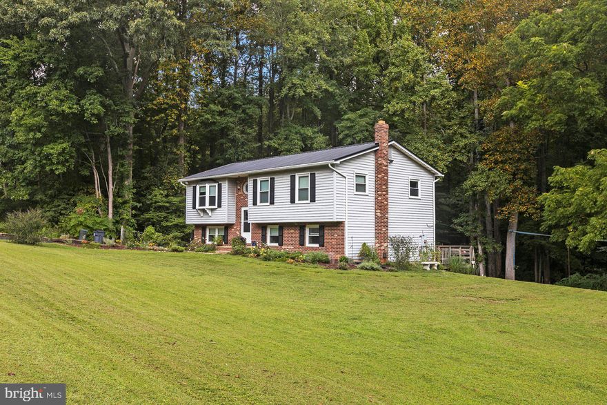 Adorable split foyer on large lot in Country Lakes! Enjoy this beautifully landscaped peaceful setting  centrally located in Mechanicsville. This cozy home has enough bedrooms and baths for the whole family and has been beautified just for you! Newer tin roof, new blacktop driveway, windows only 4 years old, new luxury vinyl plank flooring throughout basement, new bathroom vanities, new kitchen cabinets, countertops and sink.  Soft close cabinets in kitchen with multipurpose work/desk area. Pull out storage in kitchen cabinets and so much more! Come see for your self and book your showing today!