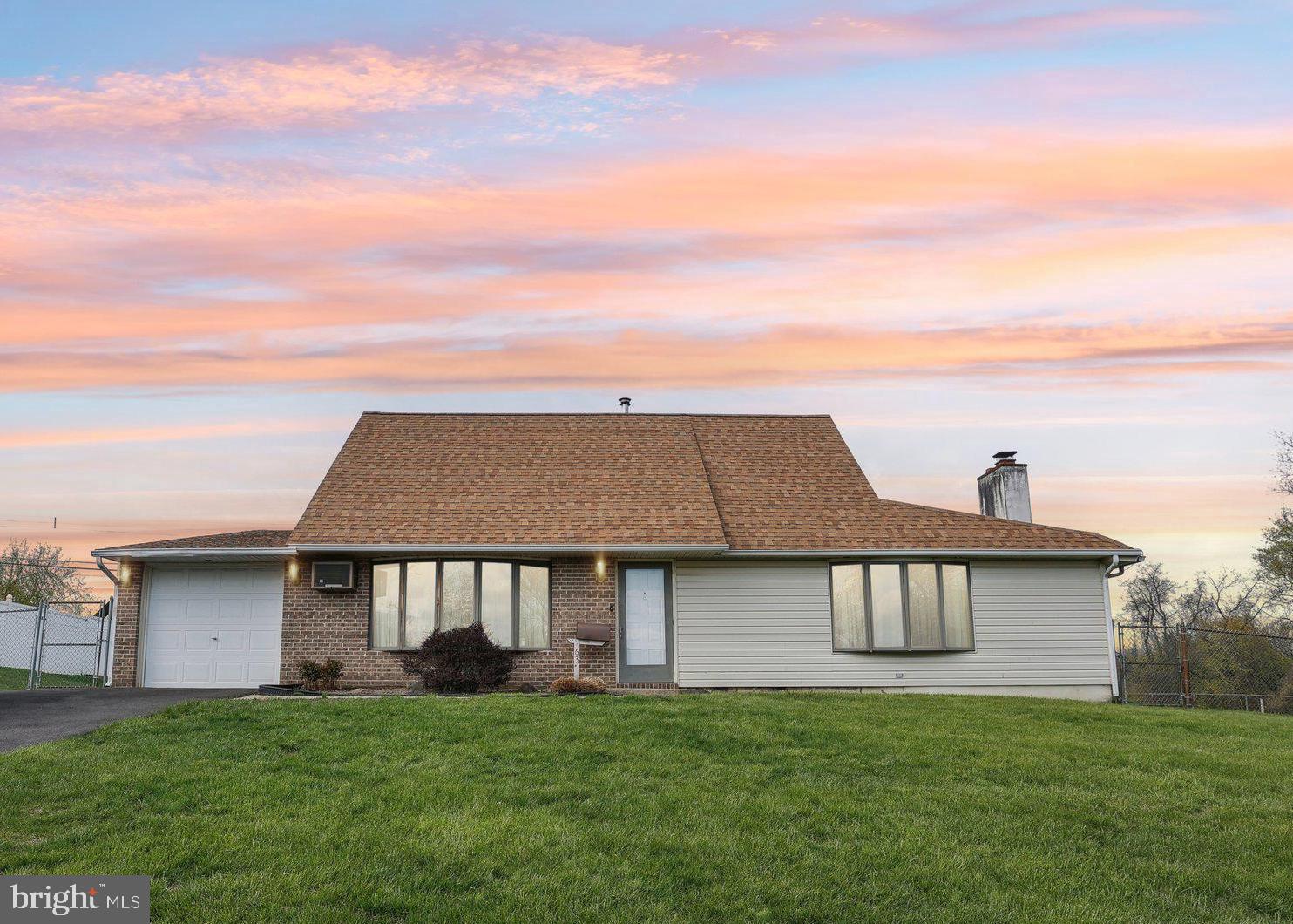 Charming expanded Jubilee with oversized Great Room and Fenced in Yard with an inground pool, in Twin Oaks. Lots of potential with this 1,983 square foot home! Enter into the lovely formal living room with large bay window with lots of natural light. This opens to the Dining Room with sliders to the covered patio which is great for entertaining. The Kitchen has a gas range and a newer refrigerator (approx 2 yrs old). Glide into the huge Great Room with wood burning fireplace and sliders to the back yard. There's a full bath on this level for easy clean ups after being in the pool. There's a deep one car garage that has pull down stairs for additional storage. Upstairs is the Primary Bedroom with attached sitting room or office with built in shelves and 2 walk in closets. This sitting room could be a 4th bedroom or nursery. The Full bath attaches the Primary and hall where the laundry is located. Two more bedrooms finish out the upper level. Out in the oversized back yard, there's an inground swimming pool and the yard is fenced in for safety. Local contractor said roof was installed in 2023 and driveway has newer seal. A few minute walk to Middletown Township Park and shopping is close by. Home is being sold as-is with buyer responsible for U&O. Estate Sale Saturday, May 3, 8-2.